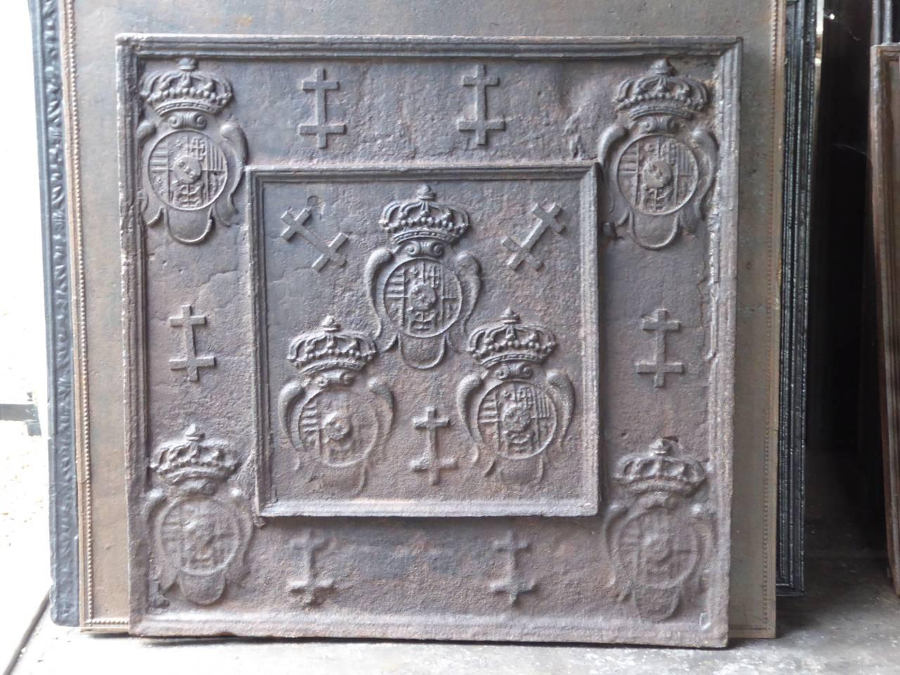 17th-18th century French fireback with the Arms of Lorraine. Seven shields with the arms of Leopold I, Duke of Lorraine and nine Lorraine crosses.

We have a unique and specialized collection of antique and used fireplace accessories consisting of