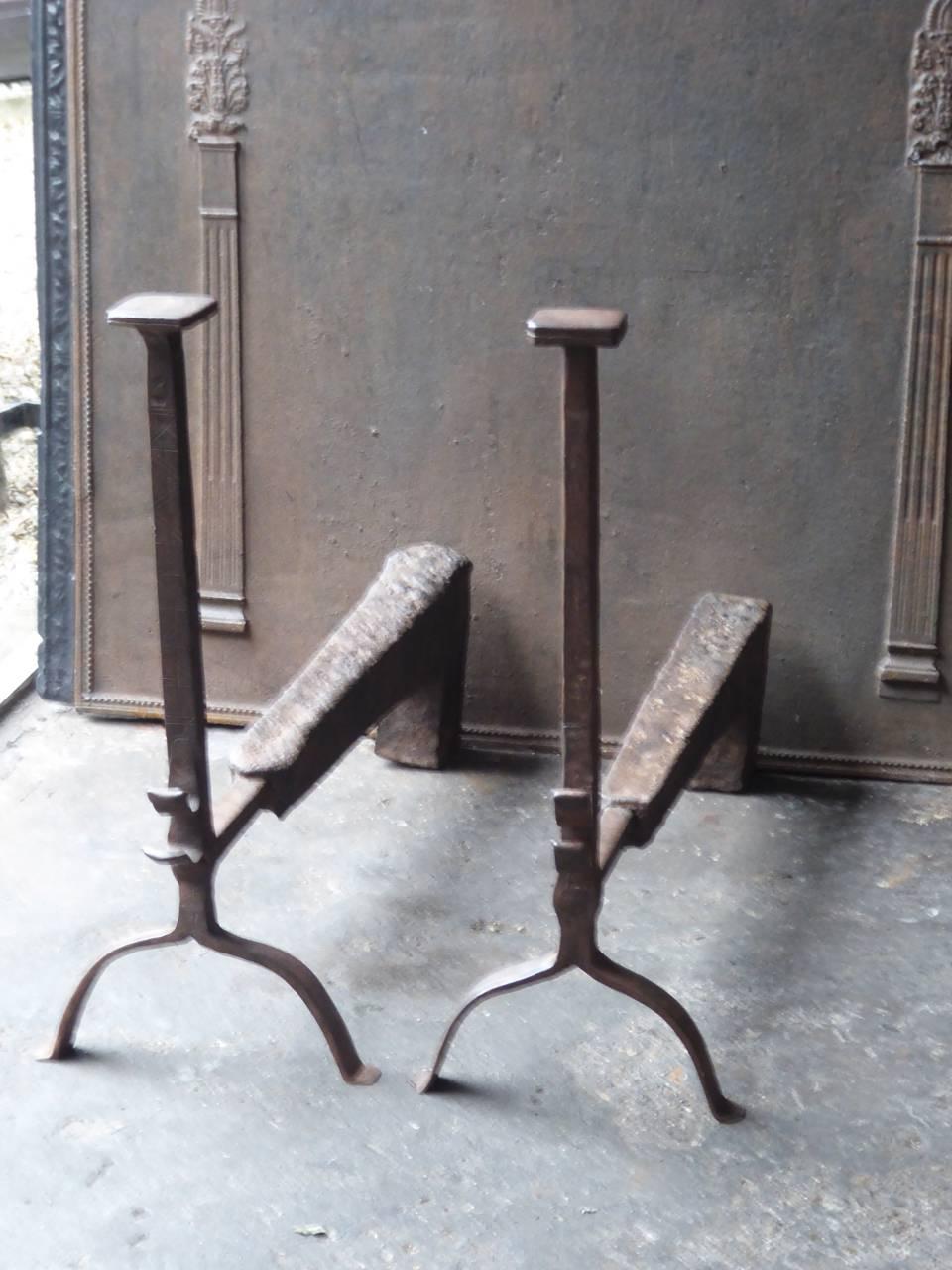 17th century, French Gothic fire dogs made of wrought iron and cast iron. Rare combination of Gothic forged iron and heavy cast iron at the back.

This product has to be shipped as freight due to its size and/or (volumetric) weight. You can contact