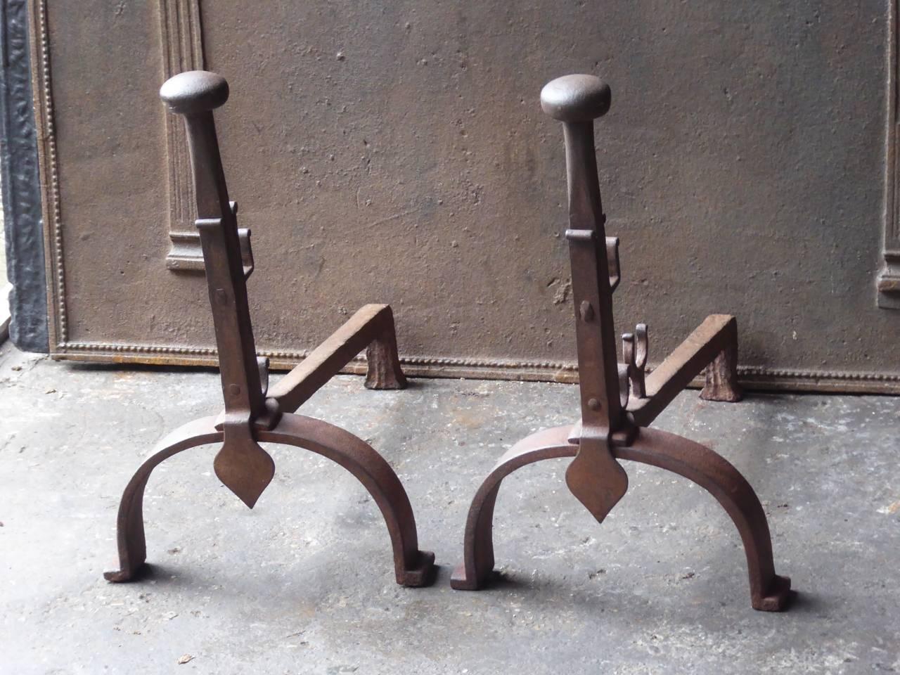 19th century French Napoleon III period firedogs made of wrought iron. The andirons have spit hooks to grill food. The condition is good.

