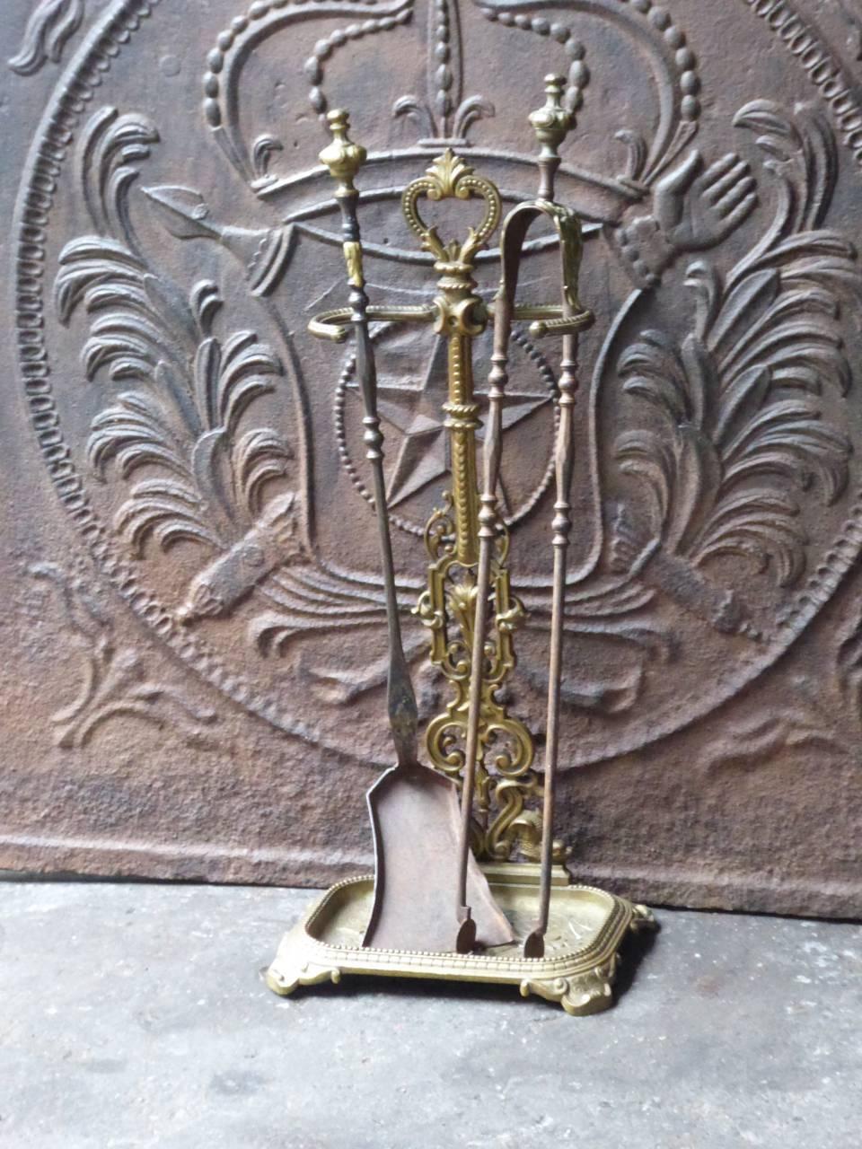 19th century, French Louis XV style fire tools, fire irons made of wrought iron and brass.

We have a unique and specialized collection of antique and used fireplace accessories consisting of more than 1000 listings at 1stdibs. Amongst others, we