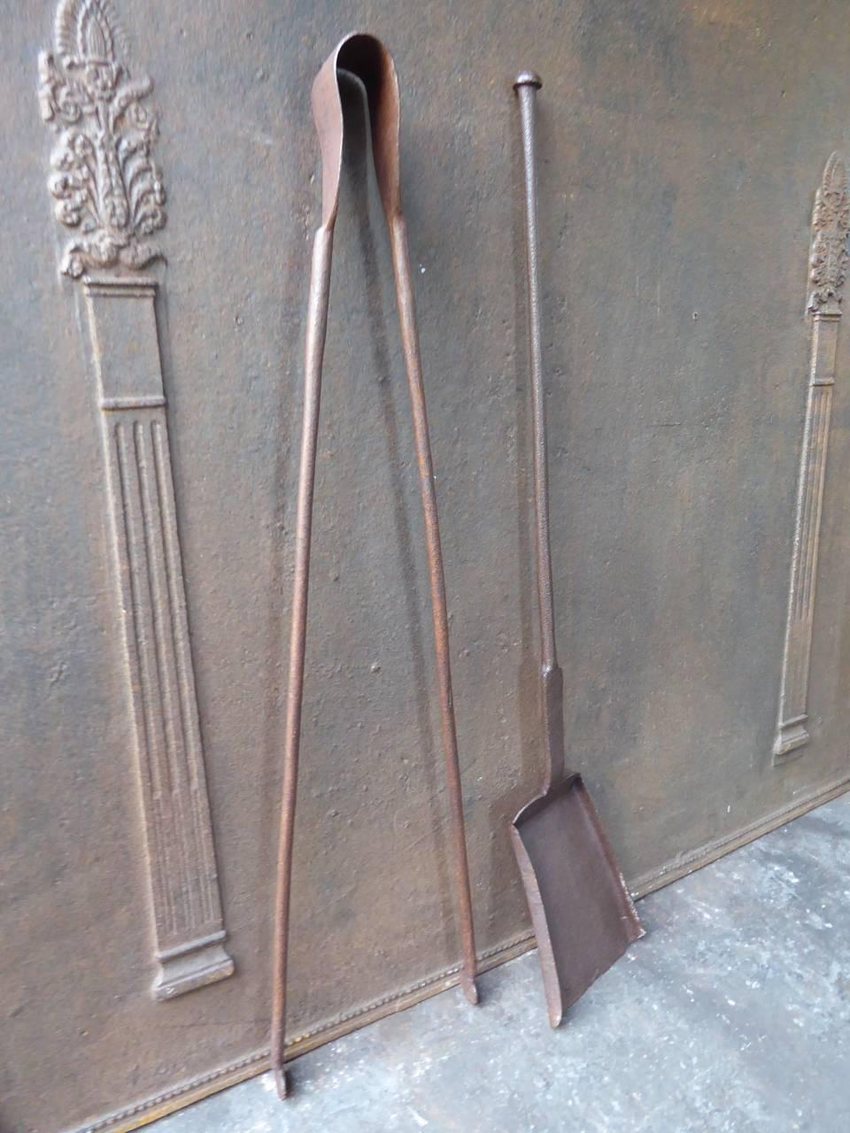 18th century French fire tools - fire irons made of wrought iron.

We have a unique and specialized collection of antique and used fireplace accessories consisting of more than 1000 listings at 1stdibs. Amongst others, we always have 300+ firebacks,