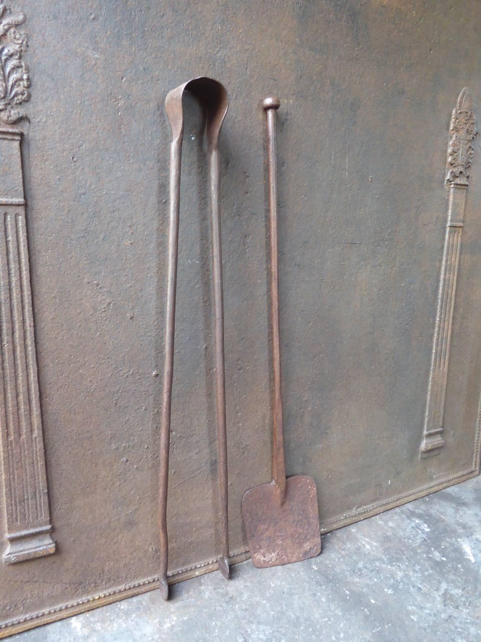 18th century French fireplace toolset made of wrought iron.

We have a unique and specialized collection of antique and used fireplace accessories consisting of more than 1000 listings at 1stdibs. Amongst others, we always have 300+ firebacks, 250+