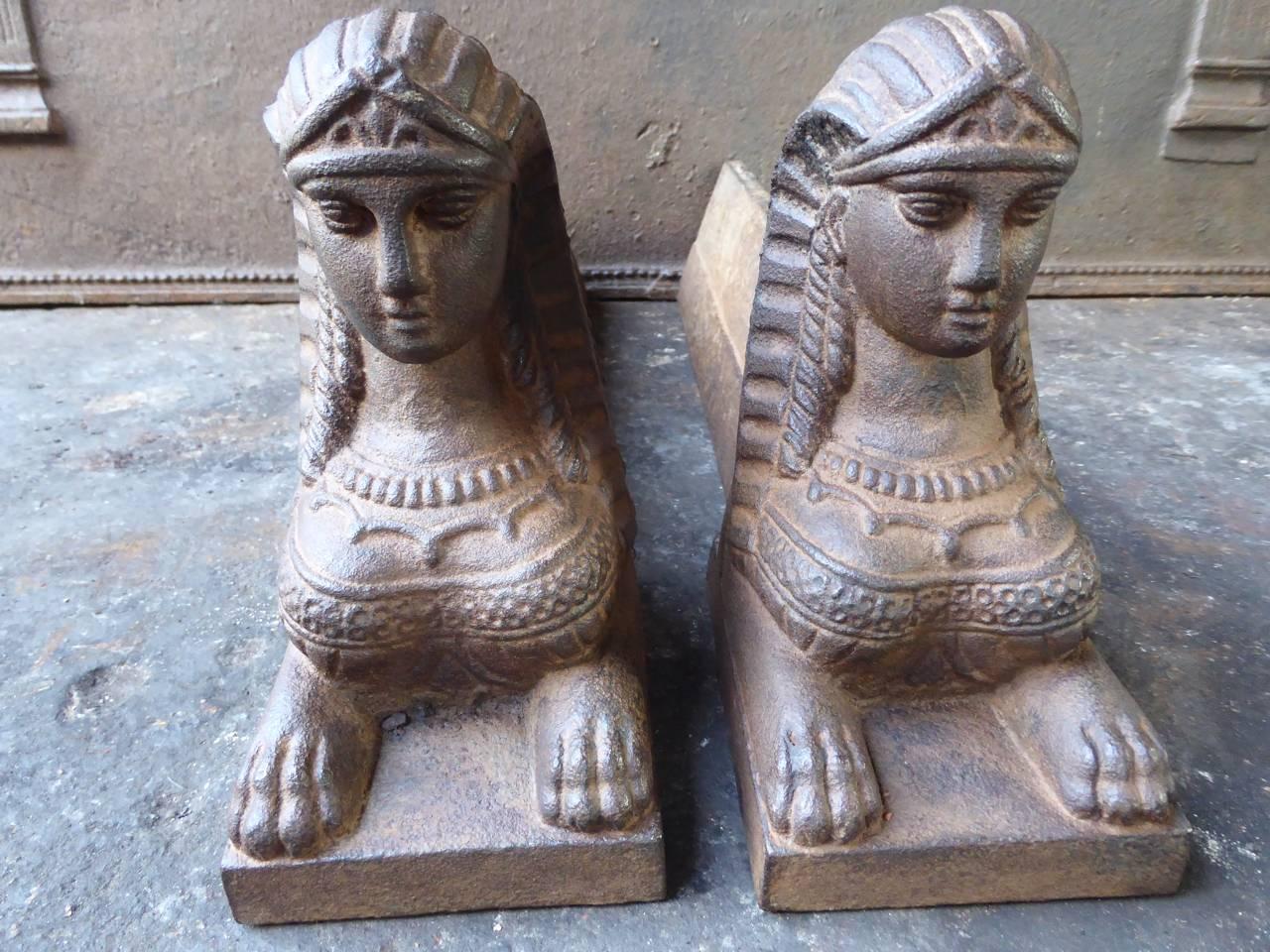 19th century French Sphinx fire dogs made of cast iron. The andirons have a natural brown patina. Upon request they can be made black.

We have a unique and specialized collection of antique and used fireplace accessories consisting of more than