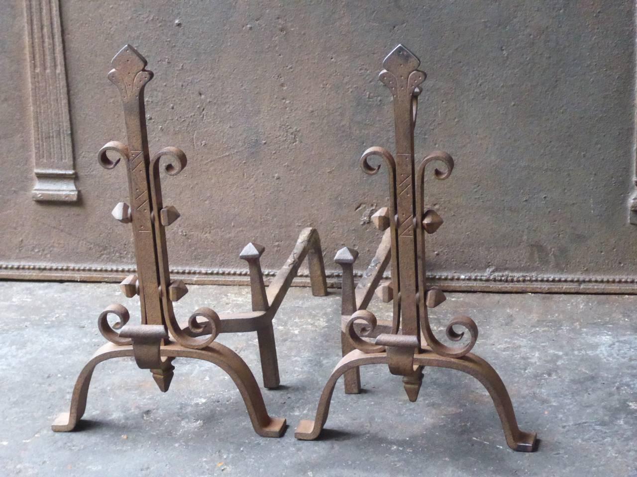 20th century French fire dogs made of wrought iron.

We have a unique and specialized collection of antique and used fireplace accessories consisting of more than 1000 listings at 1stdibs. Amongst others, we always have 300+ firebacks, 250+ pairs of