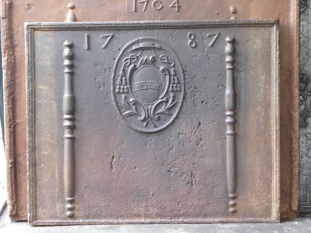 French fireback with a coat of arms, two pillars and the date of production 1787.

This product weighs more than 65 kg / 143 lbs. All our products that weigh 66 kg / 146 lbs or more are shipped as standard door-to-door freight. You can contact us to