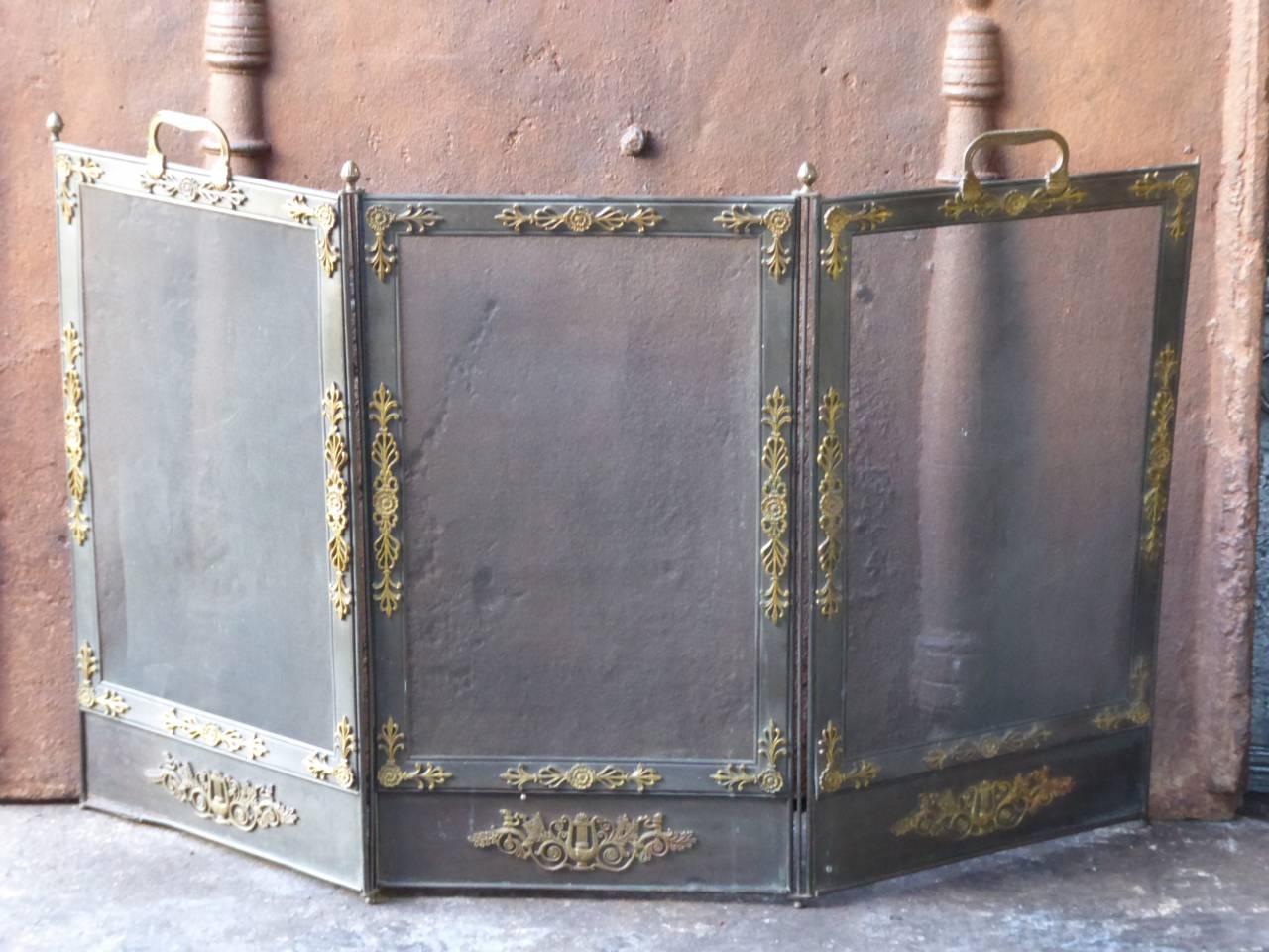 19th century French fireplace screen made of iron, brass and iron mesh.

We have a unique and specialized collection of antique and used fireplace accessories consisting of more than 1000 listings at 1stdibs. Amongst others, we always have 300+