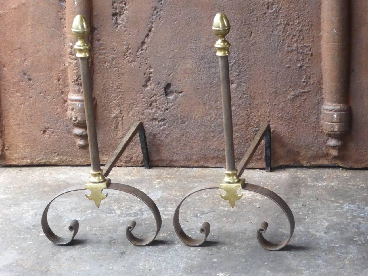 French andirons made of wrought iron and brass.