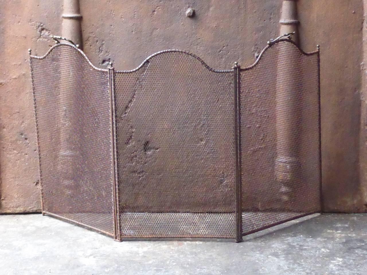 19th century French fireplace screen made of iron and iron mesh.