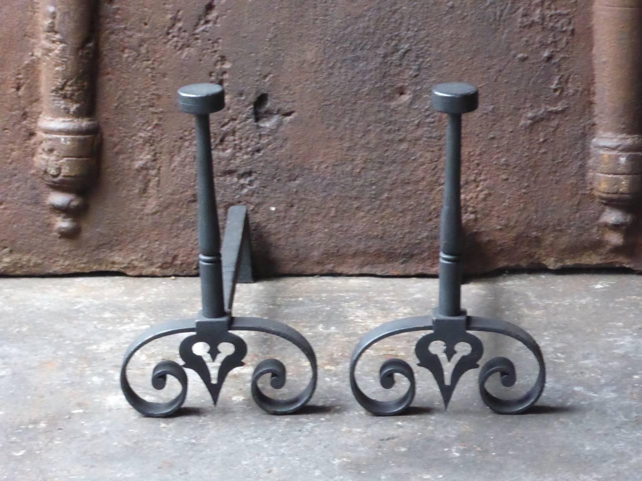 19th century French fire dogs made of wrought iron.

We have a unique and specialized collection of antique and used fireplace accessories consisting of more than 1000 listings at 1stdibs. Amongst others, we always have 300+ firebacks, 250+ pairs of