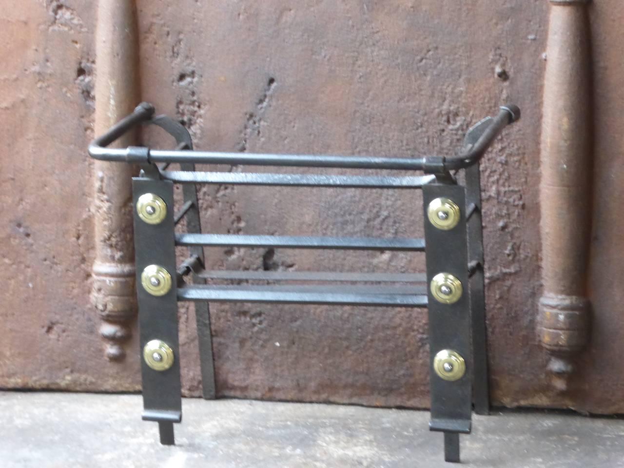 18th century Dutch fire grate made of wrought iron and brass.

We have a unique and specialized collection of antique and used fireplace accessories consisting of more than 1000 listings at 1stdibs. Amongst others, we always have 300+ firebacks,