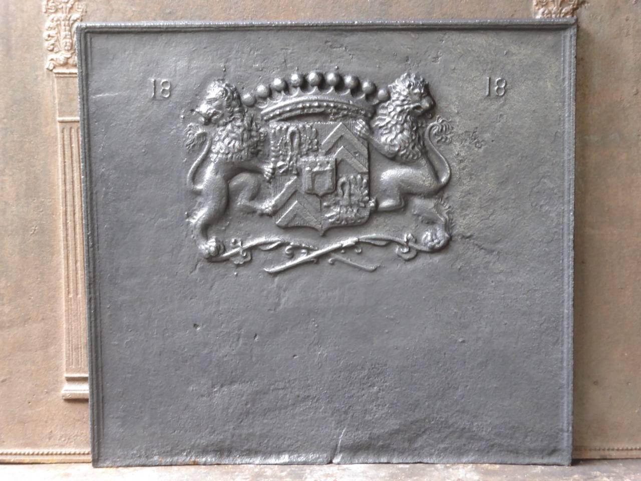 French fireback with a coat of arms and the date of production 1818. It is an unknown coat of arms. The crown suggests royalty.