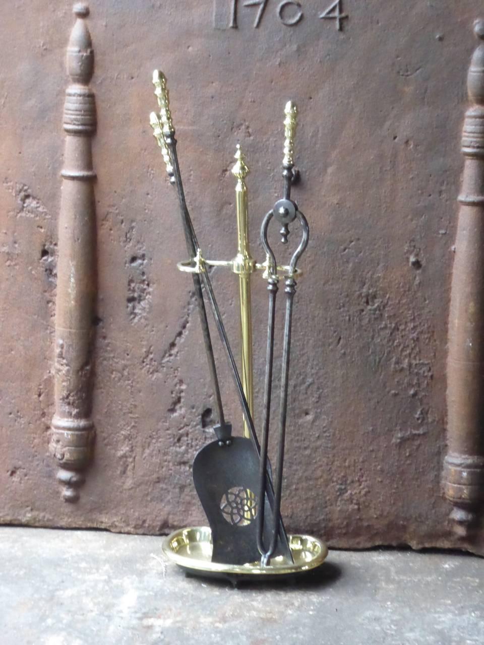 19th century English fireplace tool set - fire irons made of wrought iron and polished brass.

We have a unique and specialized collection of antique and used fireplace accessories consisting of more than 1000 listings at 1stdibs. Amongst others, we