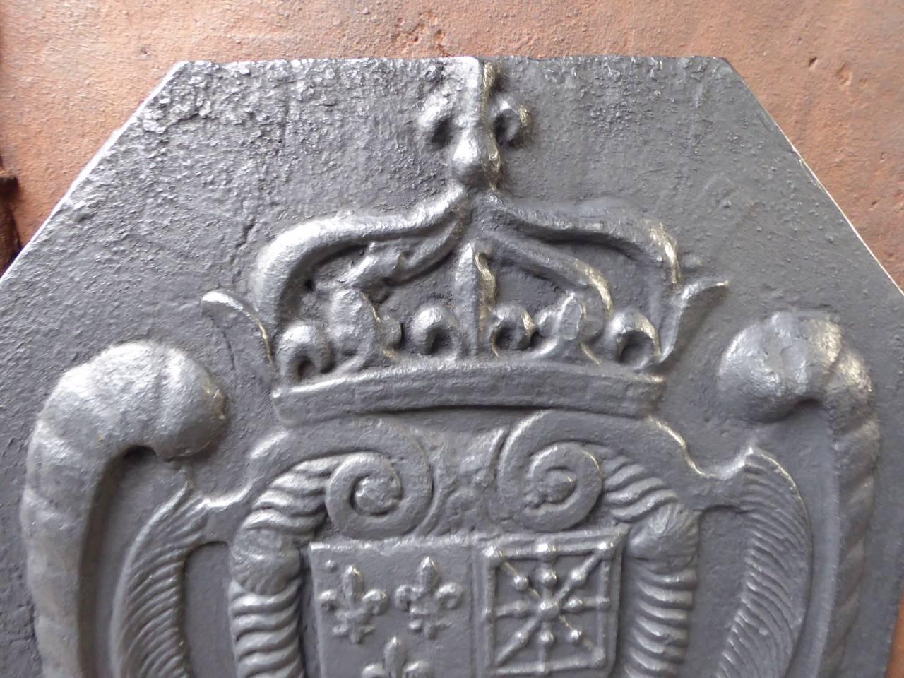 17th century French fireback with the Arms of France and Navarre. 

Arms of the House of Bourbon from France, one of the major royal dynasties of Europe that produced monarchs Spain (Navarre), France, the two Sicilies and Parma. Bourbon kings ruled