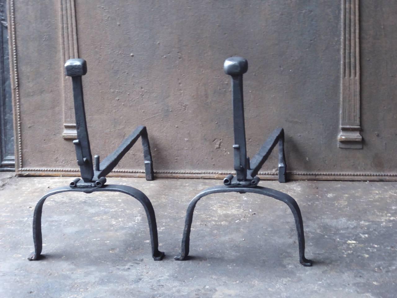 18th century French Gothic fire dogs made of wrought iron.

We have a unique and specialized collection of antique and used fireplace accessories consisting of more than 1000 listings at 1stdibs. Amongst others, we always have 500+ firebacks, 400+