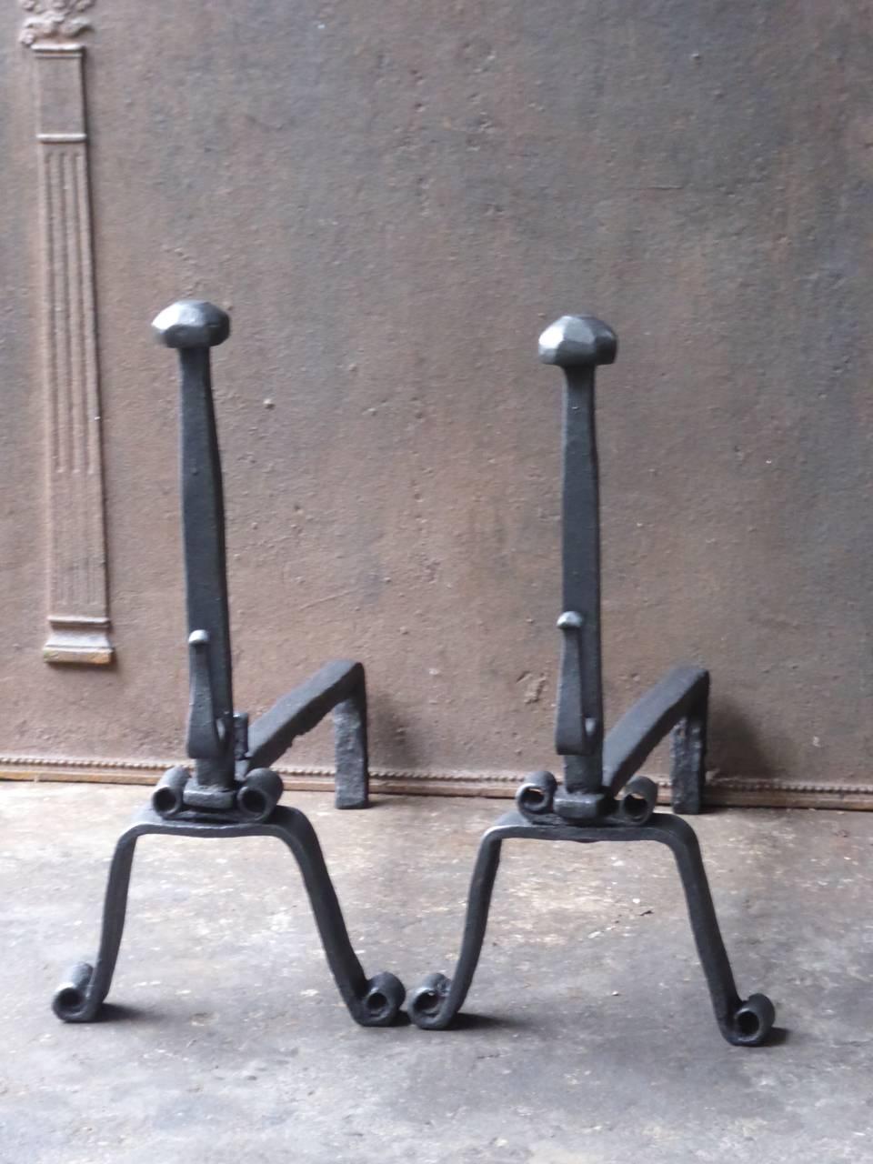 18th century French Gothic fire dogs made of wrought iron.

We have a unique and specialized collection of antique and used fireplace accessories consisting of more than 1000 listings at 1stdibs. Amongst others, we always have 300+ firebacks, 250+