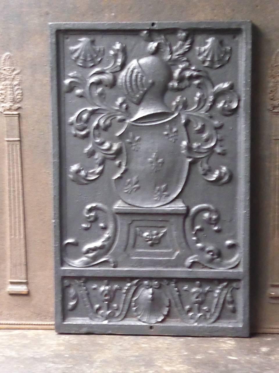 French Louis XIV style fireback with a coat of arms.

The fireback is made of cast iron and has a black / pewter patina. The condition is good, no cracks.

This product weighs more than 65 kg / 143 lbs. All our products that weigh 66 kg / 146 lbs or