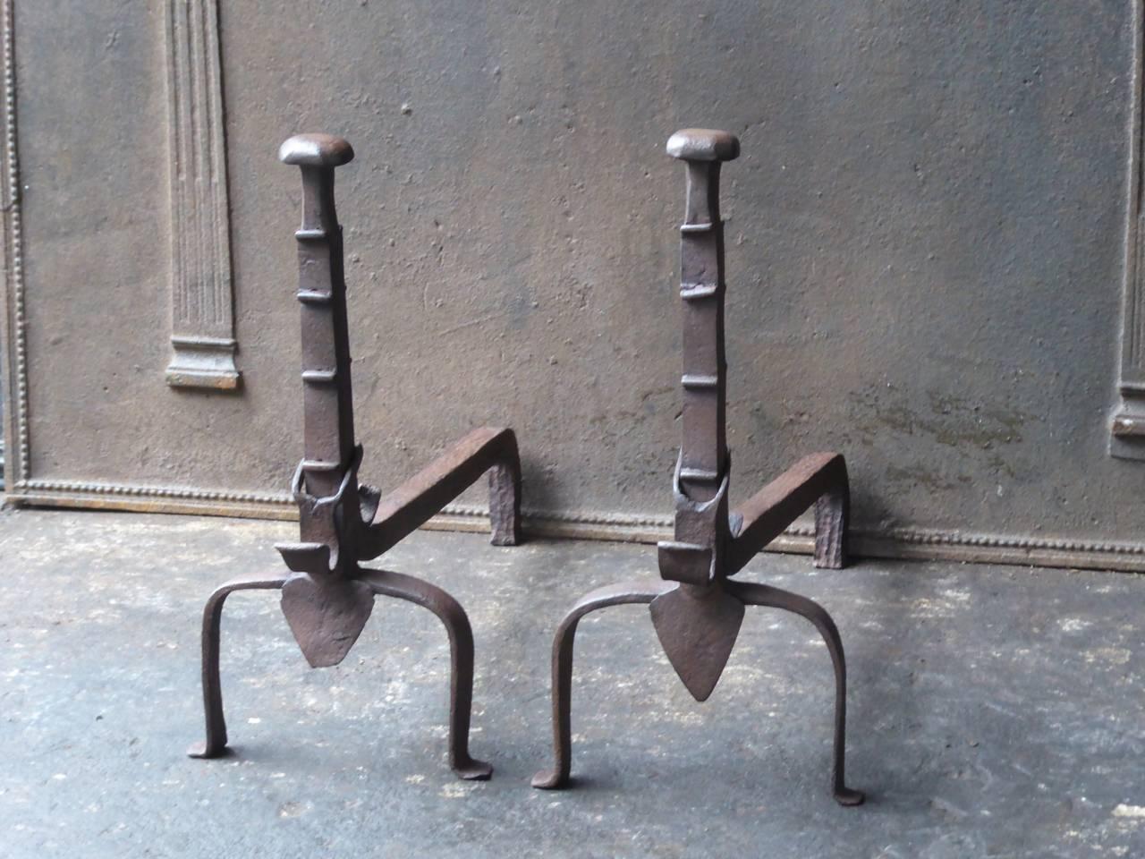 18th-19th century French fire dogs made of wrought iron.

We have a unique and specialized collection of antique and used fireplace accessories consisting of more than 1000 listings at 1stdibs. Amongst others, we always have 300+ firebacks, 250+