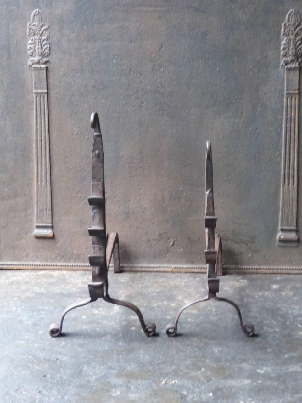 17th-18th century French Gothic fire dogs made of wrought iron. The andirons have spit hooks. The condition is good.

