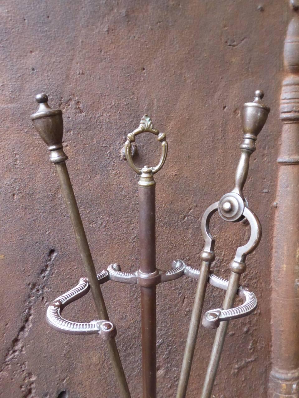 19th century English fireplace tool set, fire irons made of wrought iron and brass.

We have a unique and specialized collection of antique and used fireplace accessories consisting of more than 1000 listings at 1stdibs. Amongst others, we always