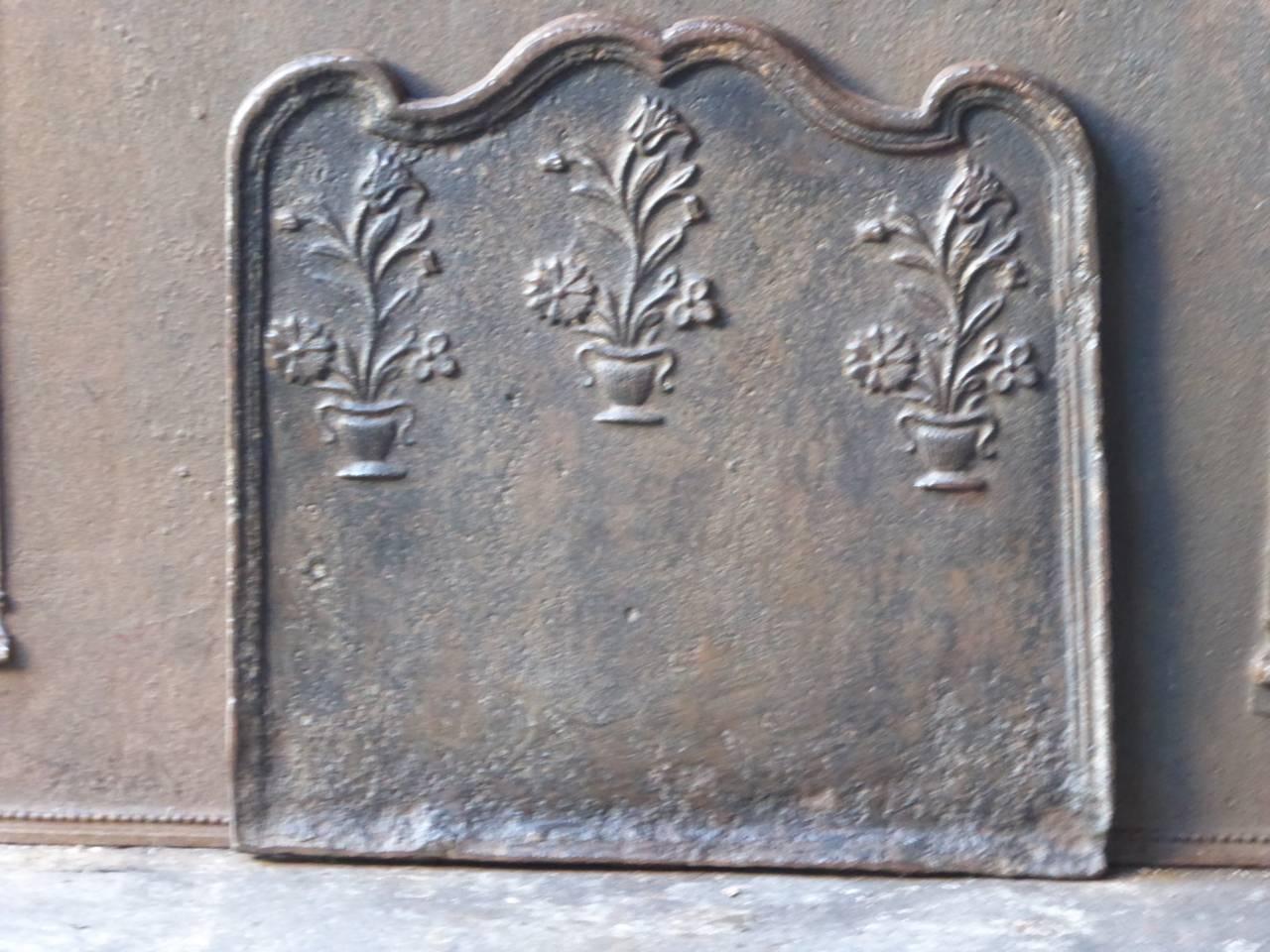 18th century French fireplace fireback with three flower baskets.

We have a unique and specialized collection of antique and used fireplace accessories consisting of more than 1000 listings at 1stdibs. Amongst others, we always have 300+ firebacks,