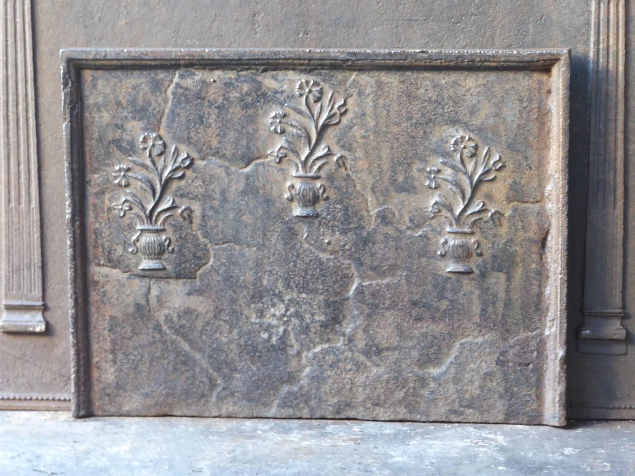 18th century French fireplace fireback with three flower baskets.