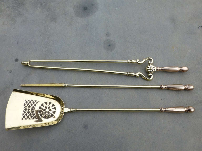 An impressive set of English fireplace tool set with copper and brass. Very fine quality and good weight.