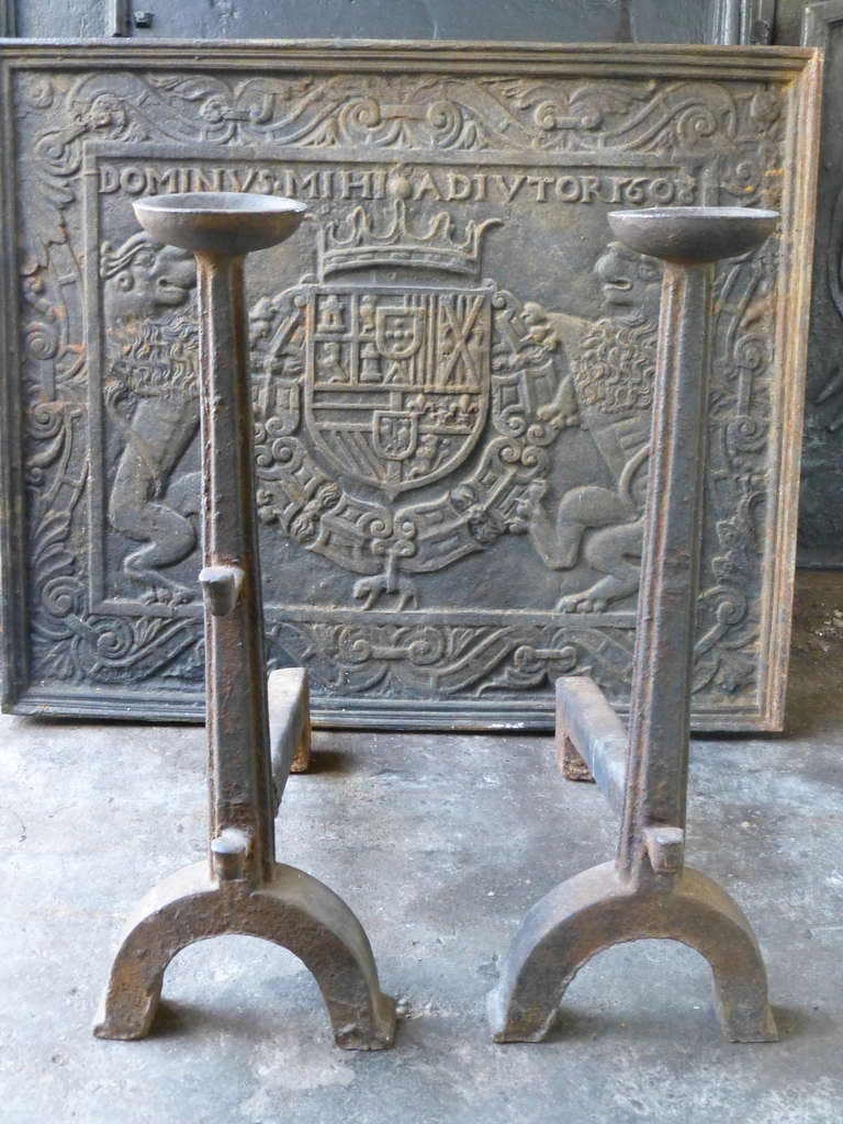 Impressive gothic fire dogs with spit hooks with faces. These French andirons are called 'landiers' in France. This dates from the times the andirons were the main cooking equipment in the house. They had spit hooks to grill meat or poultry and