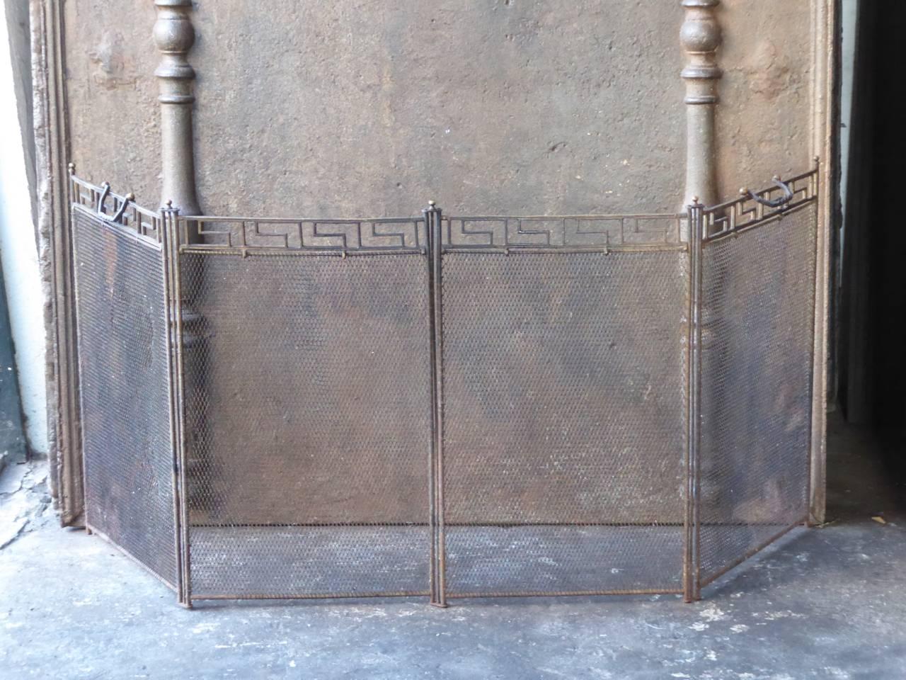 French Art Deco fireplace screen made of brass and iron.







 