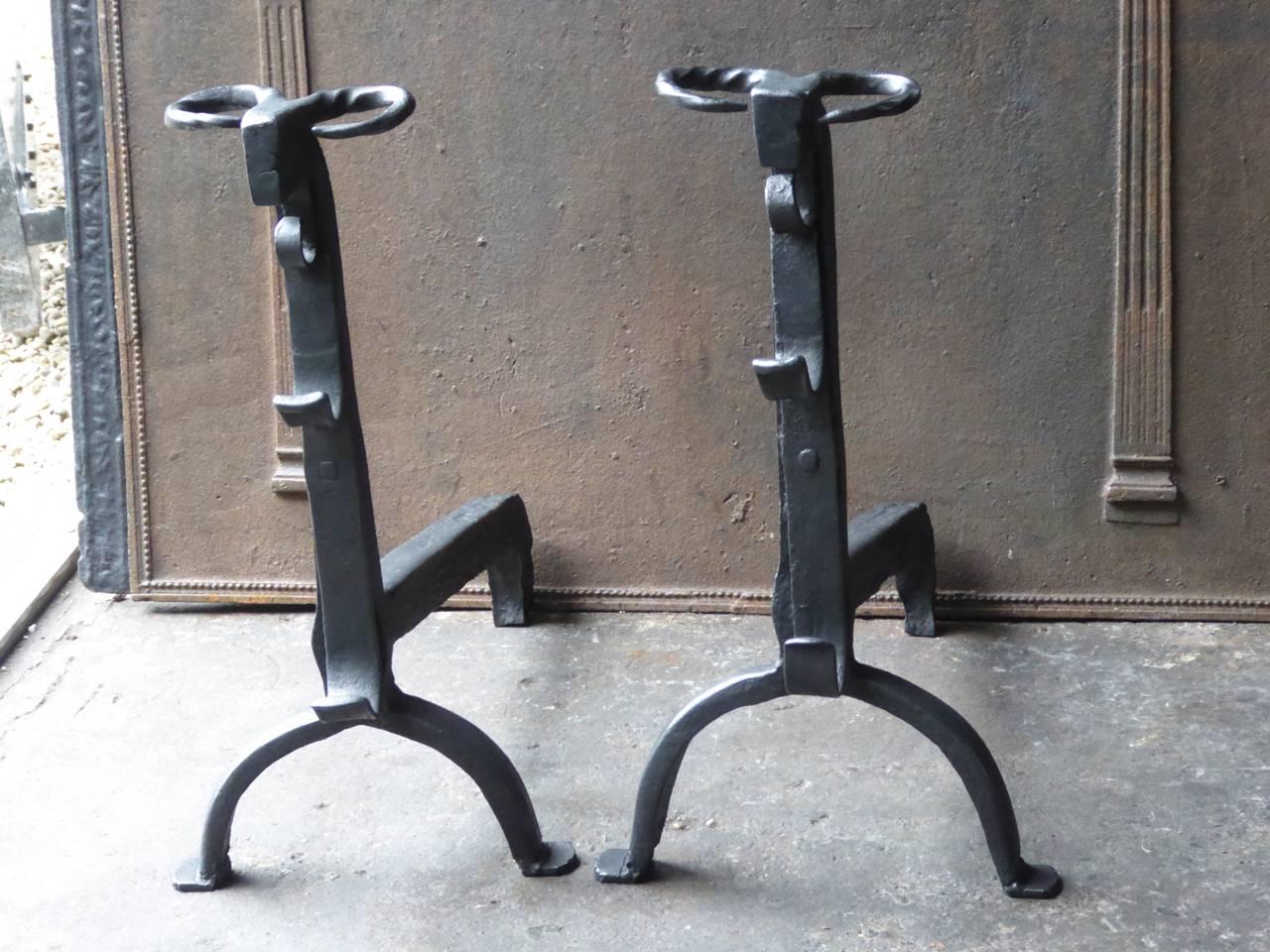 16th century French Gothic andirons made of wrought iron. The andirons have bull's heads and spit hooks.

These French andirons are called 'landiers' in France. This dates from the times the andirons were the main cooking equipment in the house.