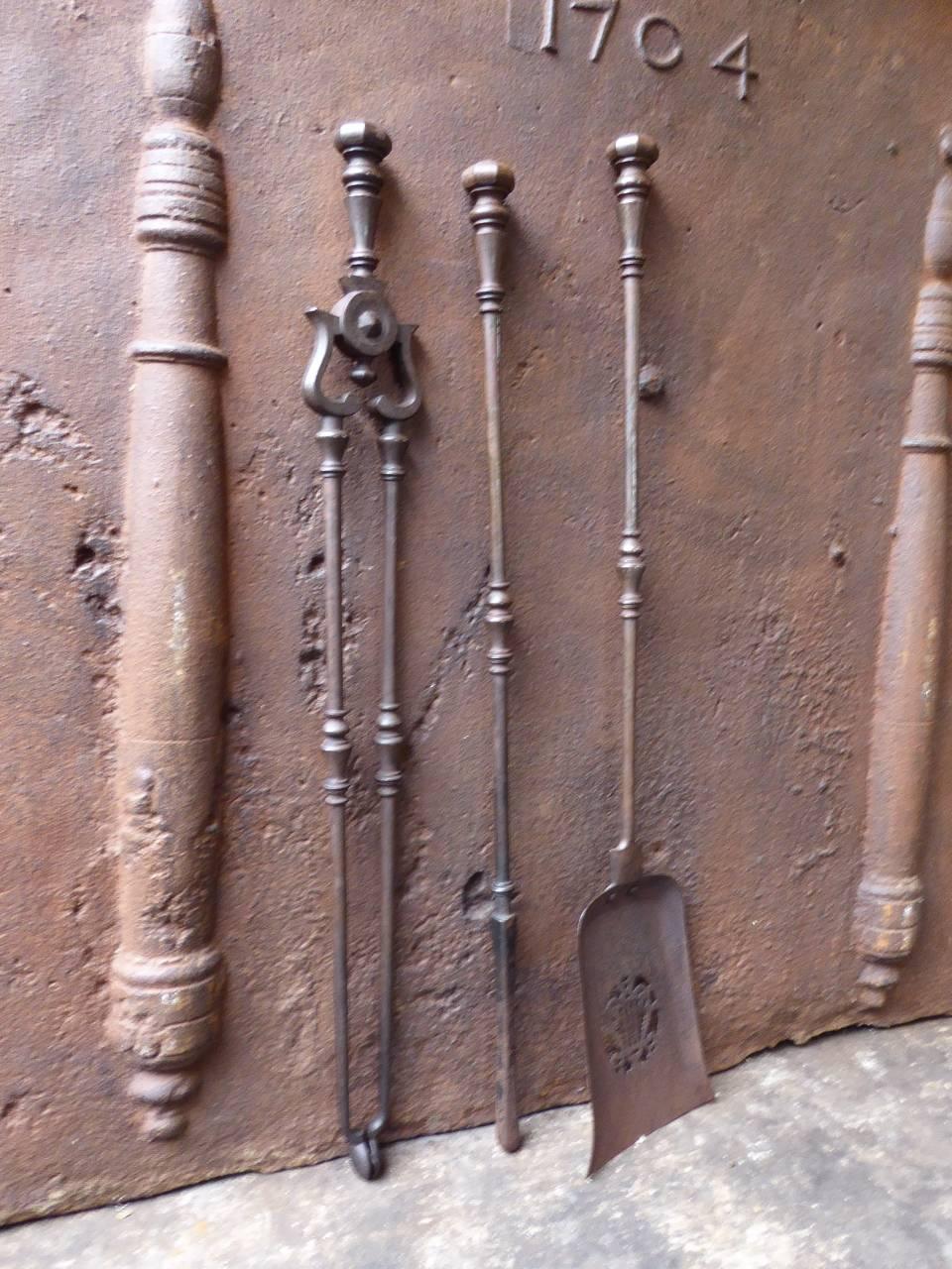19th century English fireplace tool set, fire irons made of wrought iron.

We have a unique and specialized collection of antique and used fireplace accessories consisting of more than 1000 listings at 1stdibs. Amongst others, we always have 300+