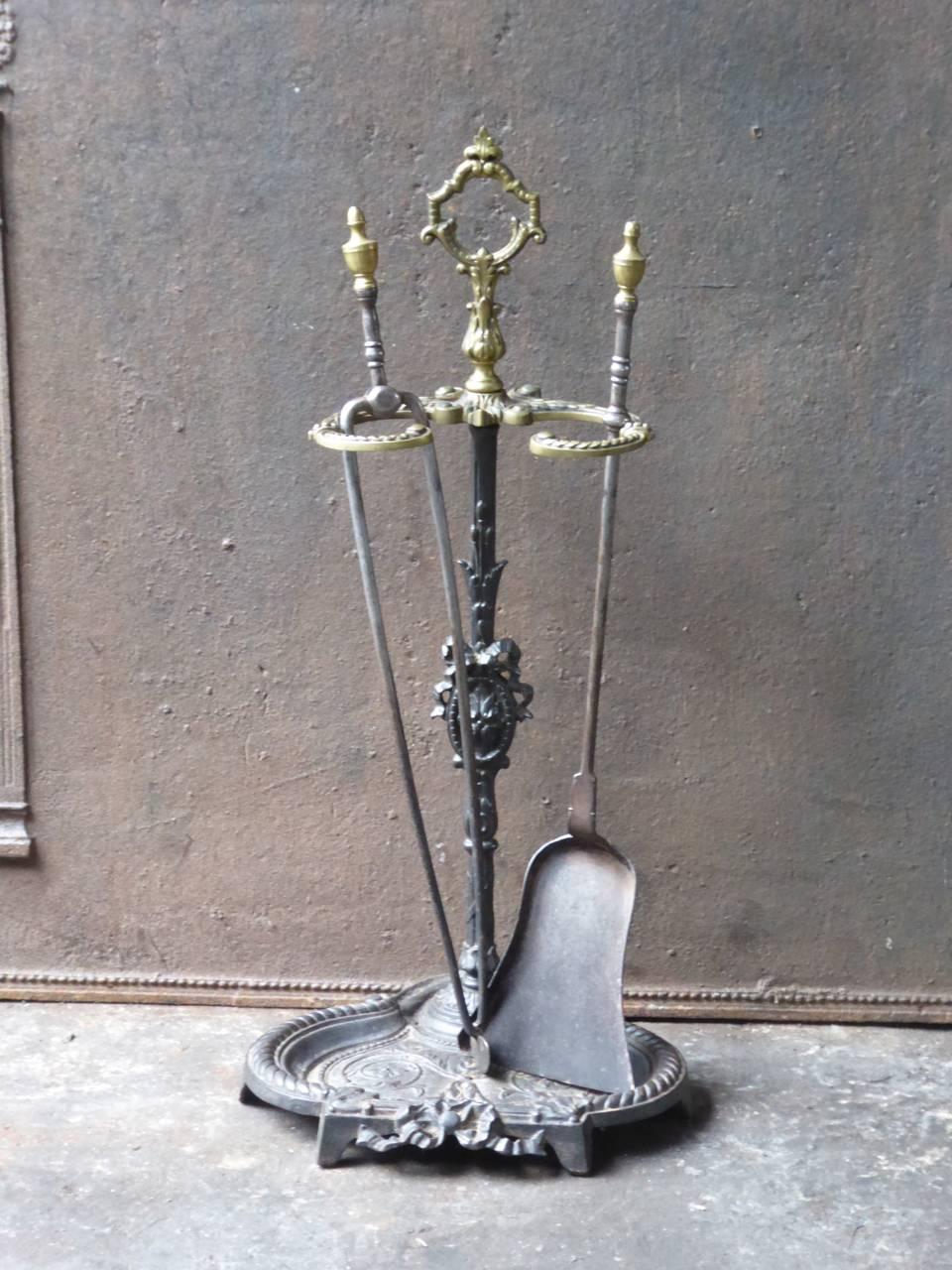 19th century French fireplace tool set, fire irons made of wrought iron and brass.

 





 