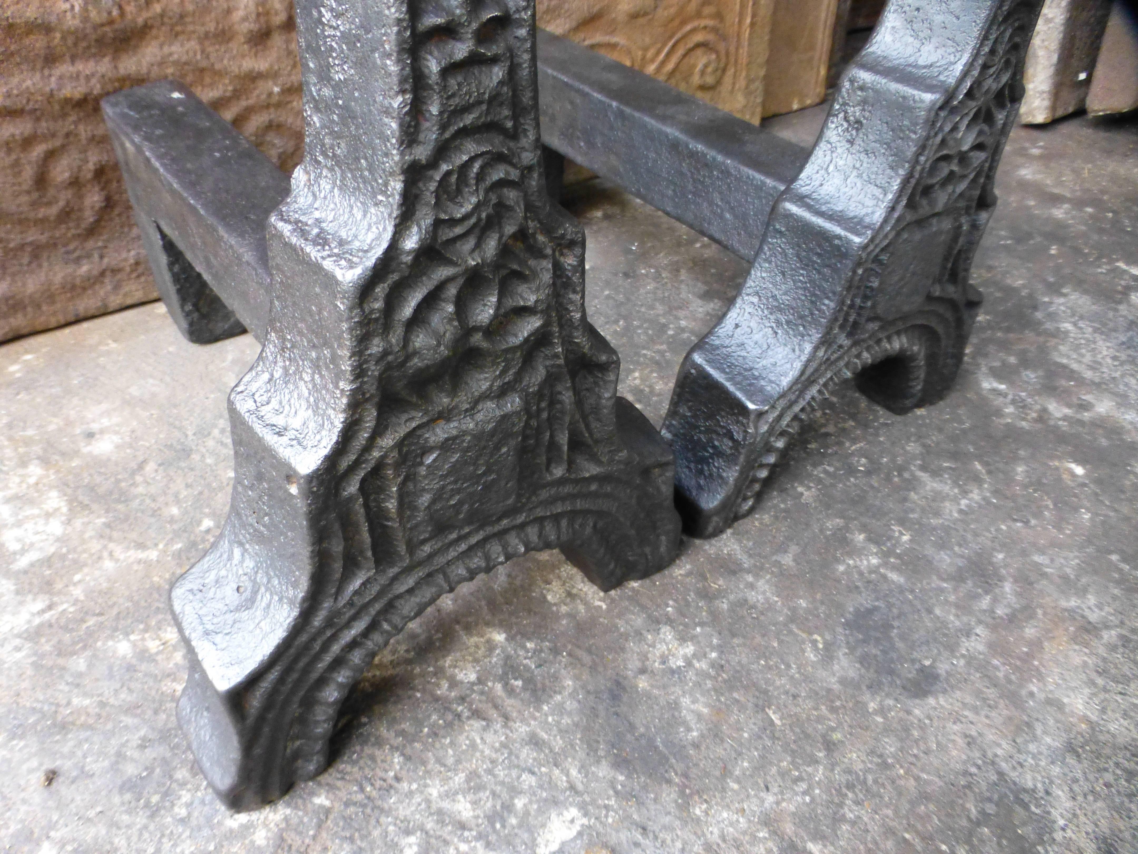 Exceptional pair of cast iron Gothic andirons.

We have a unique and specialized collection of antique and used fireplace accessories consisting of more than 1000 listings at 1stdibs. Amongst others, we always have 300+ firebacks, 250+ pairs of