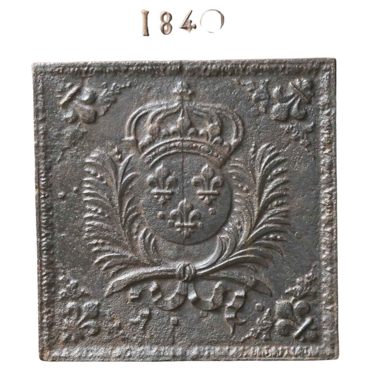 17th century French Louis XIV period fireback with the Arms of France. A coat of arms of the House of Bourbon, an originally French royal house that became a major dynasty in Europe. The house delivered kings for Spain (Navarra), France, both