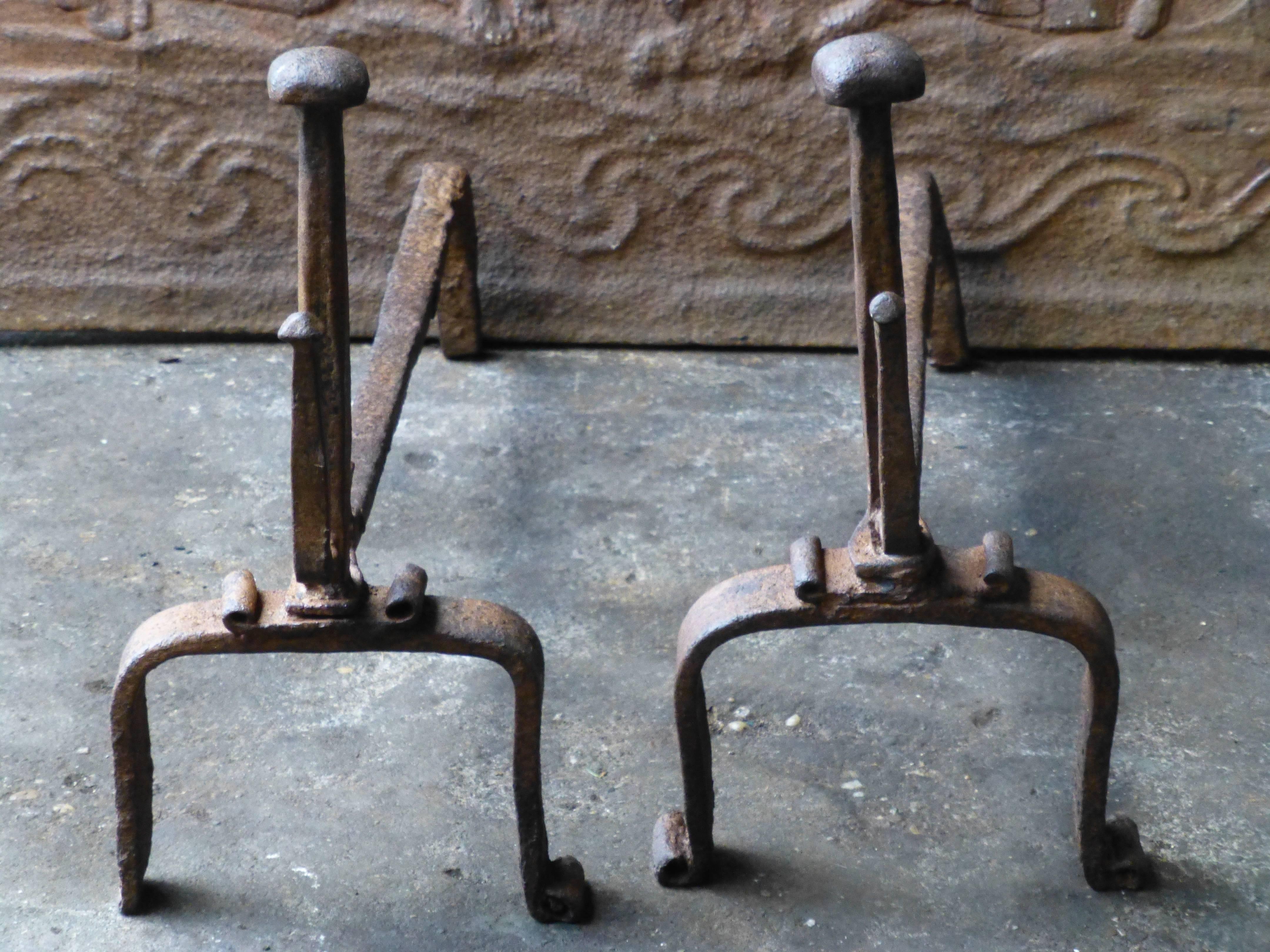 18th century Louis XV period andirons. With spit hooks to grill food. Made of hand forged wrought iron. The condition is good.