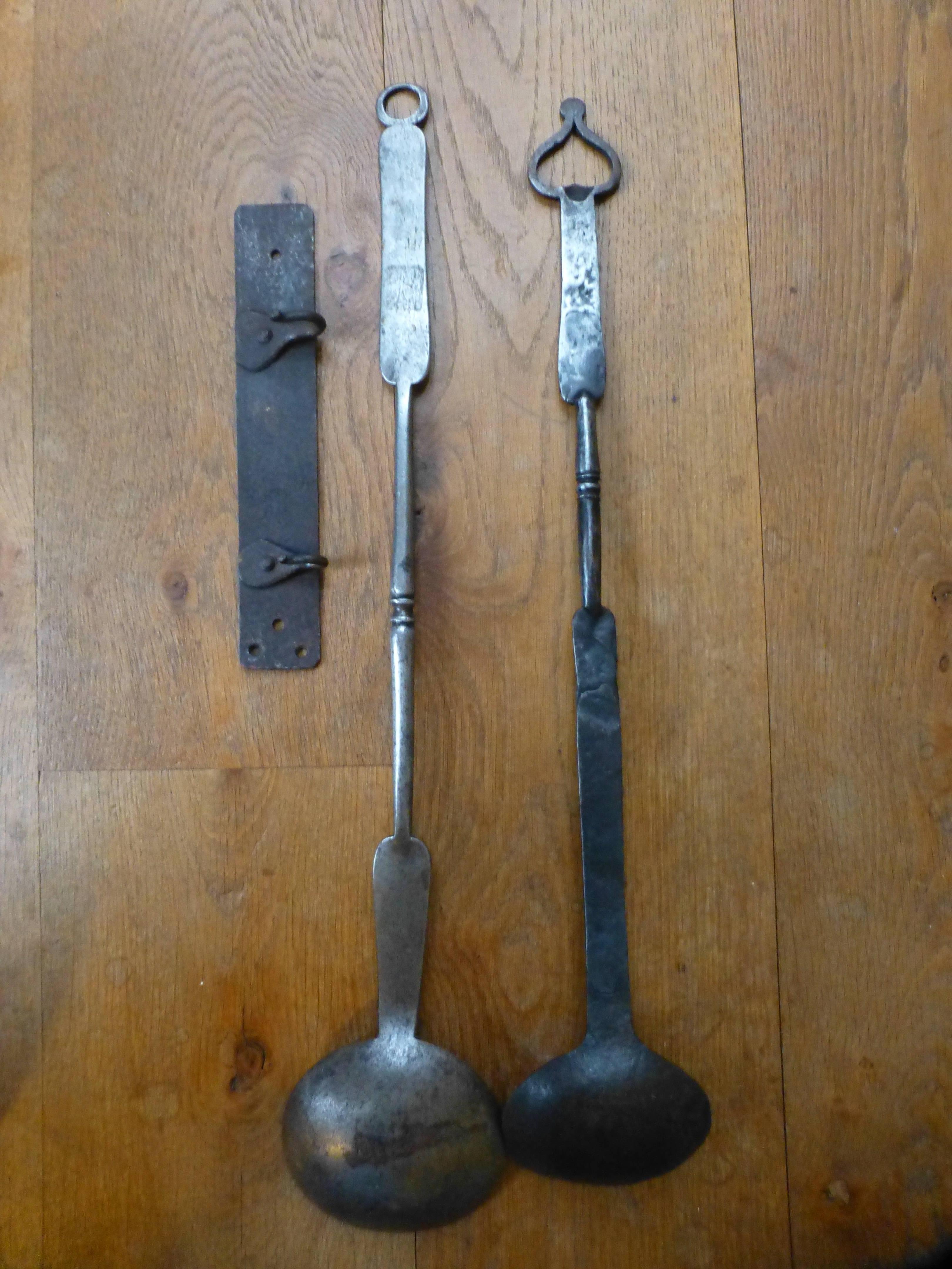 Set of 17th-18th century Dutch fireplace tools used for tasting food that is cooked in an open fire. The hanger and tools are made of wrought iron.

We have a unique and specialized collection of antique and used fireplace accessories consisting of