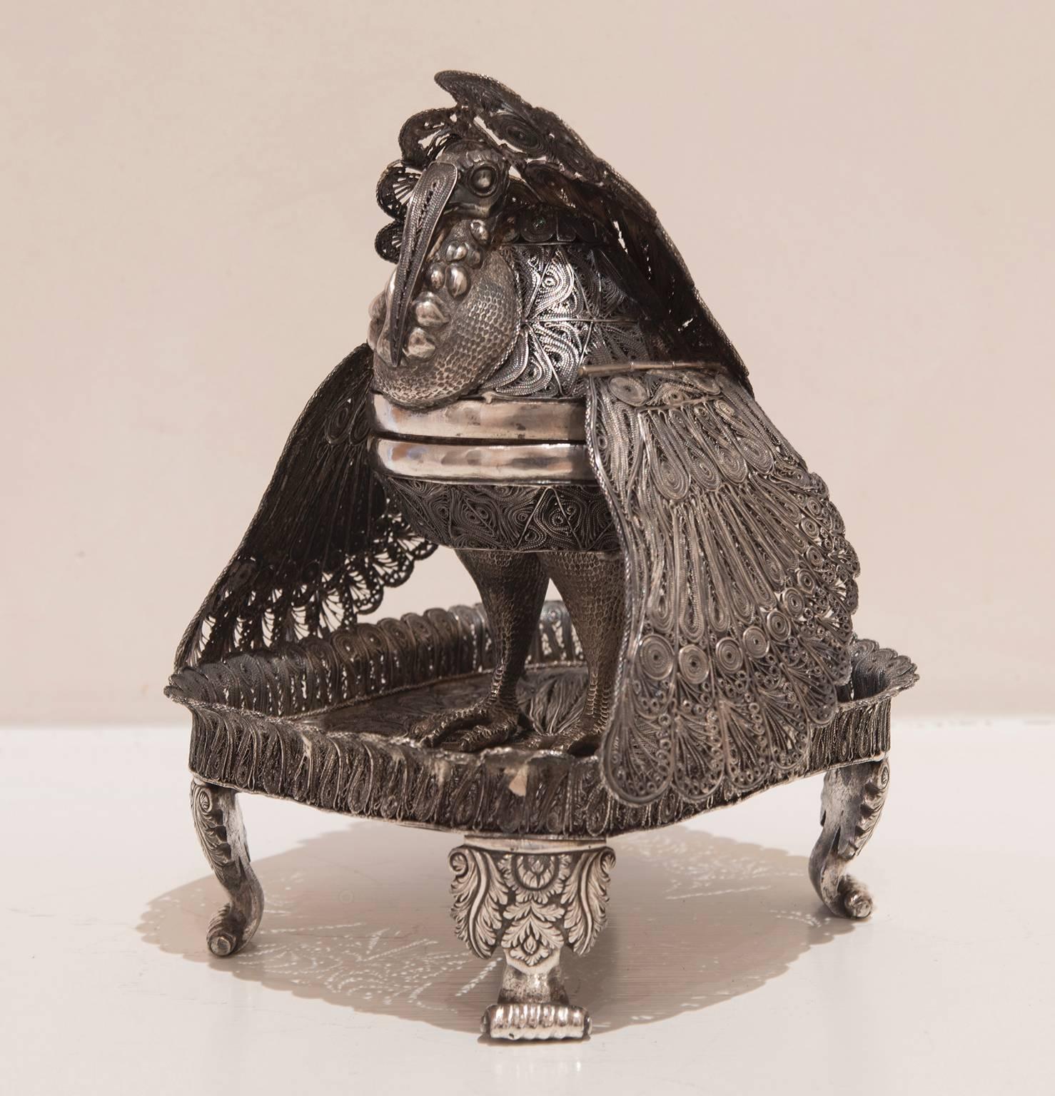 Elaborate silver filigree Turkey incensario set on a four-legged base.