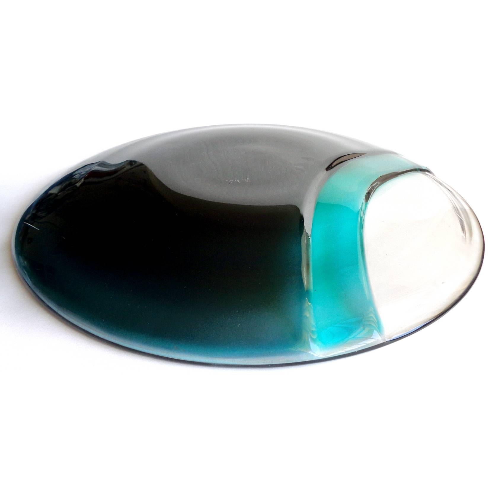 Free shipping worldwide! See details below description.

Very large Murano handblown green and clear art glass centerpiece bowl. Documented and signed by the Salviati company. The piece has a deep aqua green color, with lighter green band and