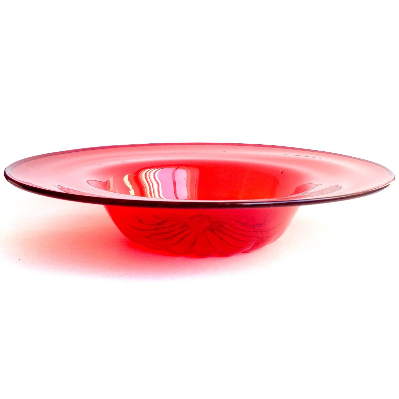 Beautiful early Murano hand blown ruby red Italian art glass centerpiece fruit bowl. Attributed to designer Napoleon Martinuzzi for Venini. The piece is very thin, with scattered bubbles throughout. 
