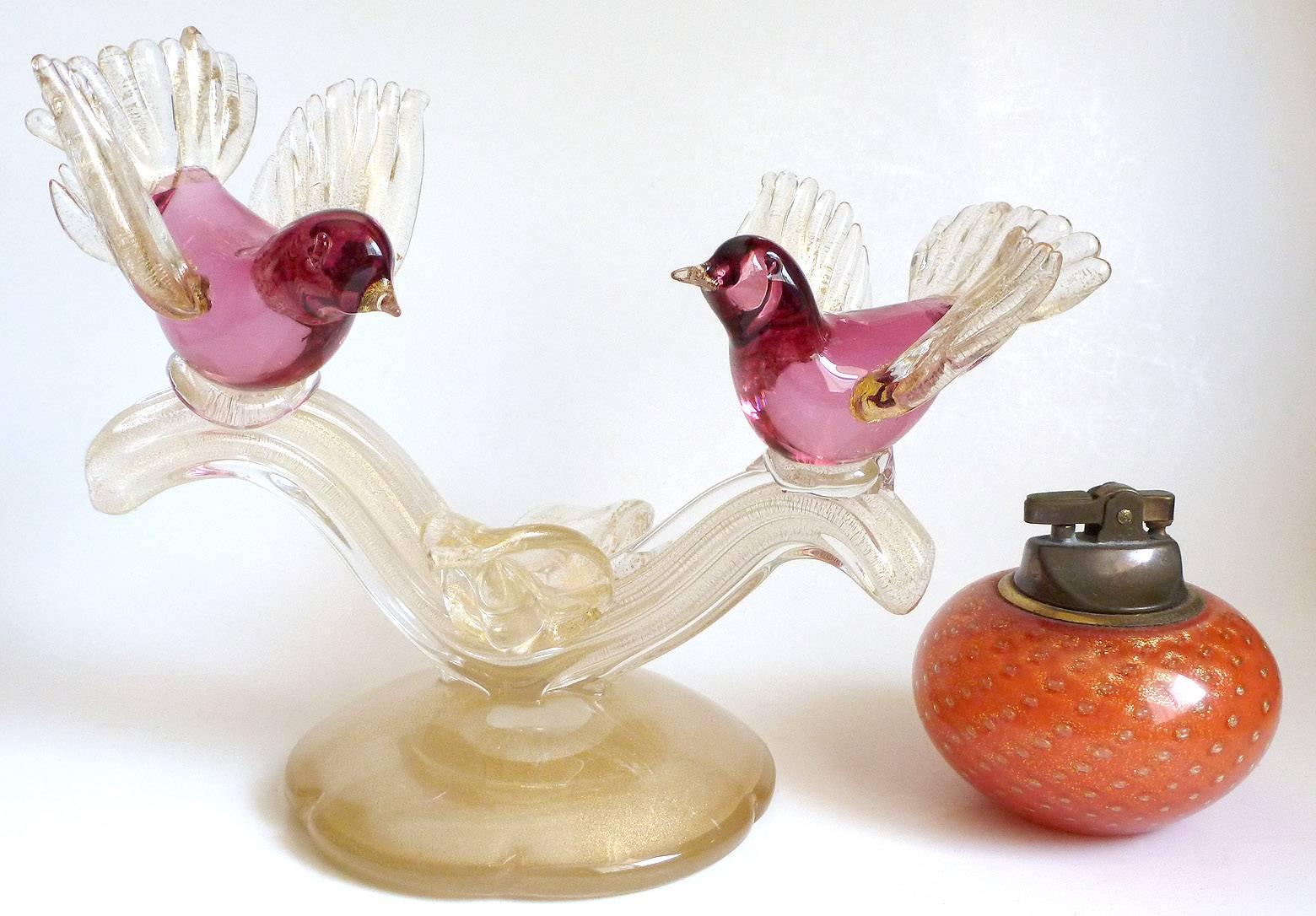 Beautiful Murano hand blown cranberry pink and gold flecks Italian art glass birds on branch sculpture. Documented as a Alfredo Barbini piece, circa 1950s, and published in his Weil Ceramics and Glass catalog. Profusely covered in gold leaf