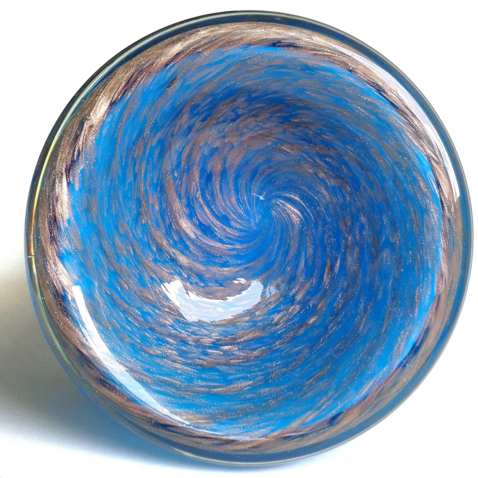 Free shipping worldwide! See details below description.

Beautiful Murano handblown blue and copper aventurine flecks art glass inverted shallow bowl. Documented to the Fratelli Toso company. The piece has a candy cane design and glitters in the