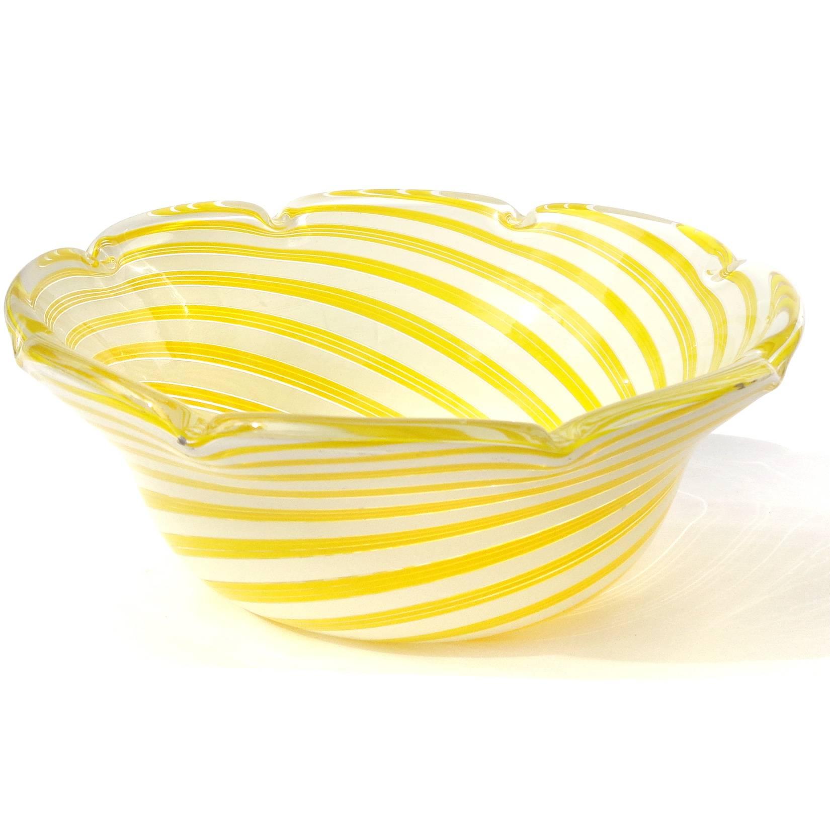 Free shipping worldwide! See details below description.

Beautiful large Murano handblown filigrana yellow and white ribbons art glass center bowl. Documented to designer Dino Martens for Aureliano Toso. The piece has a scalloped rim and would