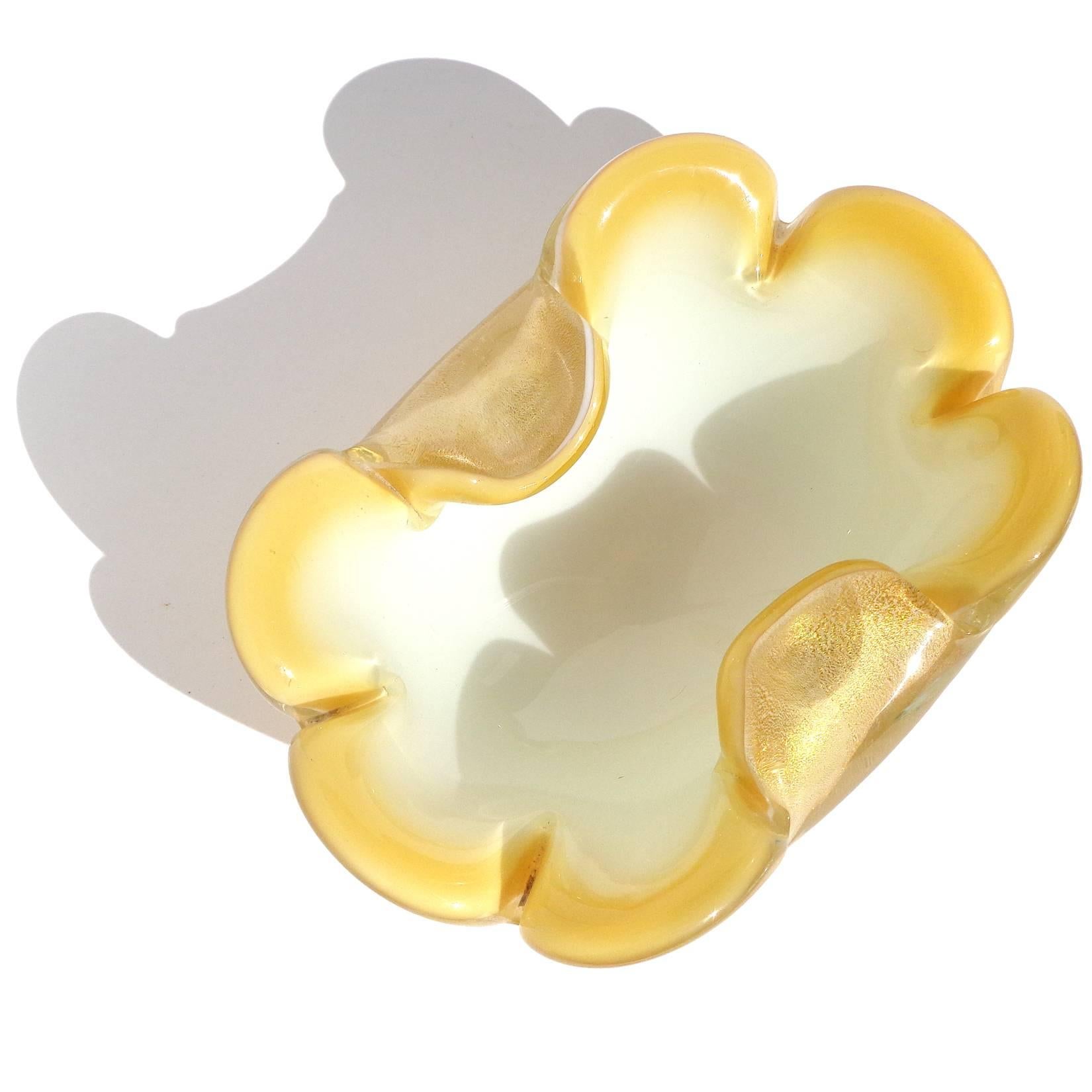 Beautiful Murano hand blown bright yellow rim, white and gold flecks Italian art glass bowl. Documented to designer Archimede Seguso. The piece is profusely covered in gold leaf, with petals as the rim. Perfect candy or jewelry dish. Also available