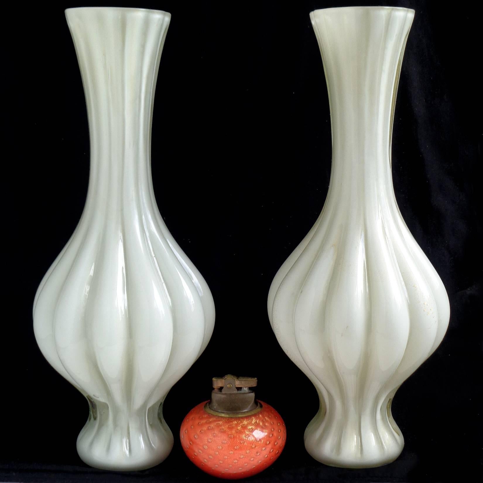 Free shipping worldwide! See details below description.

Matching pair of Murano handblown bone/light gray/white and gold flecks art glass flower vases. Created in the manner of Archimede Seguso and Alfredo Barbini. The vases have flat polished