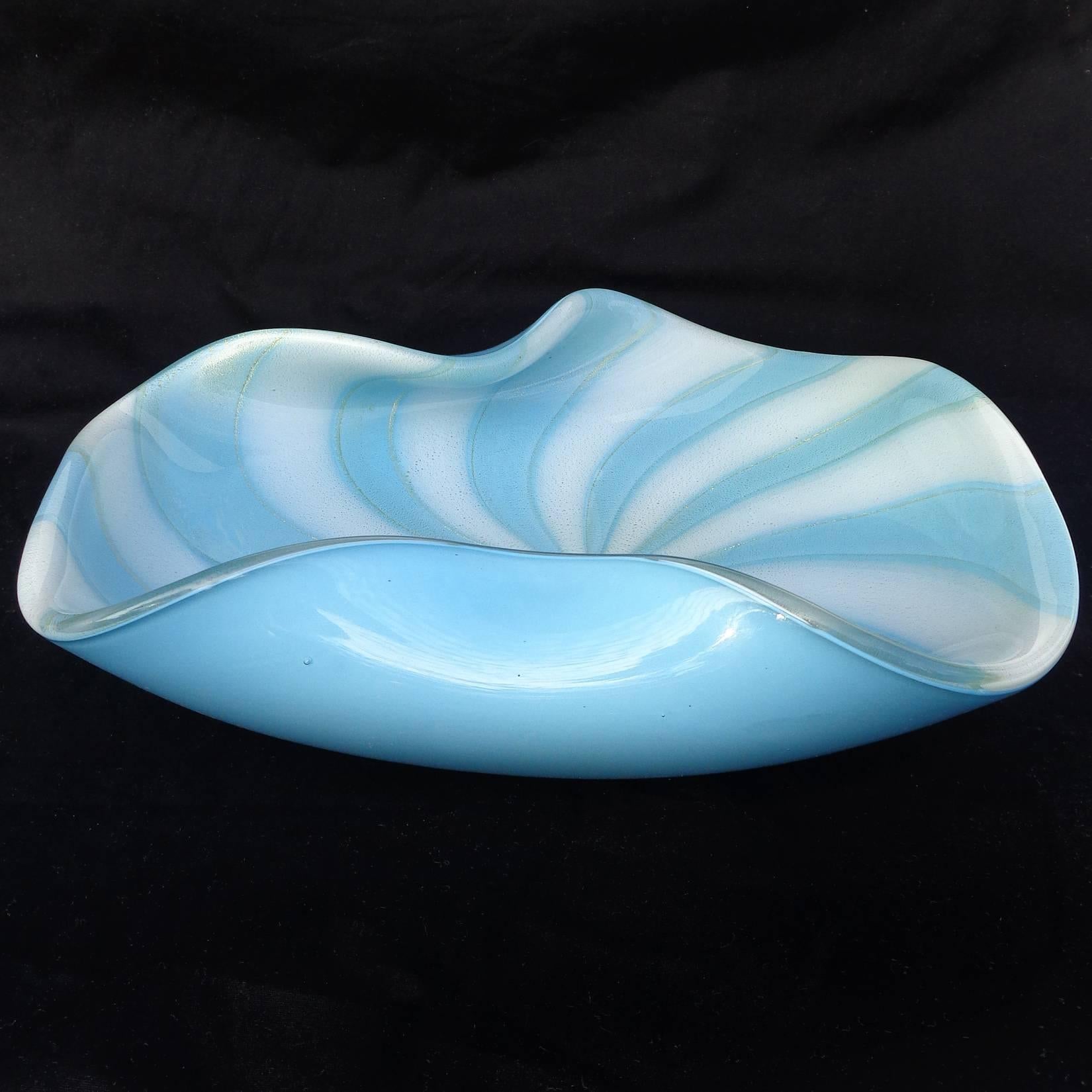 Beautiful large Murano hand blown sky blue, white stripes and gold flecks art glass bowl. Documented to designer Alfredo Barbini. The piece has folded up sides, and has heavy gold leaf throughout the inside. 
