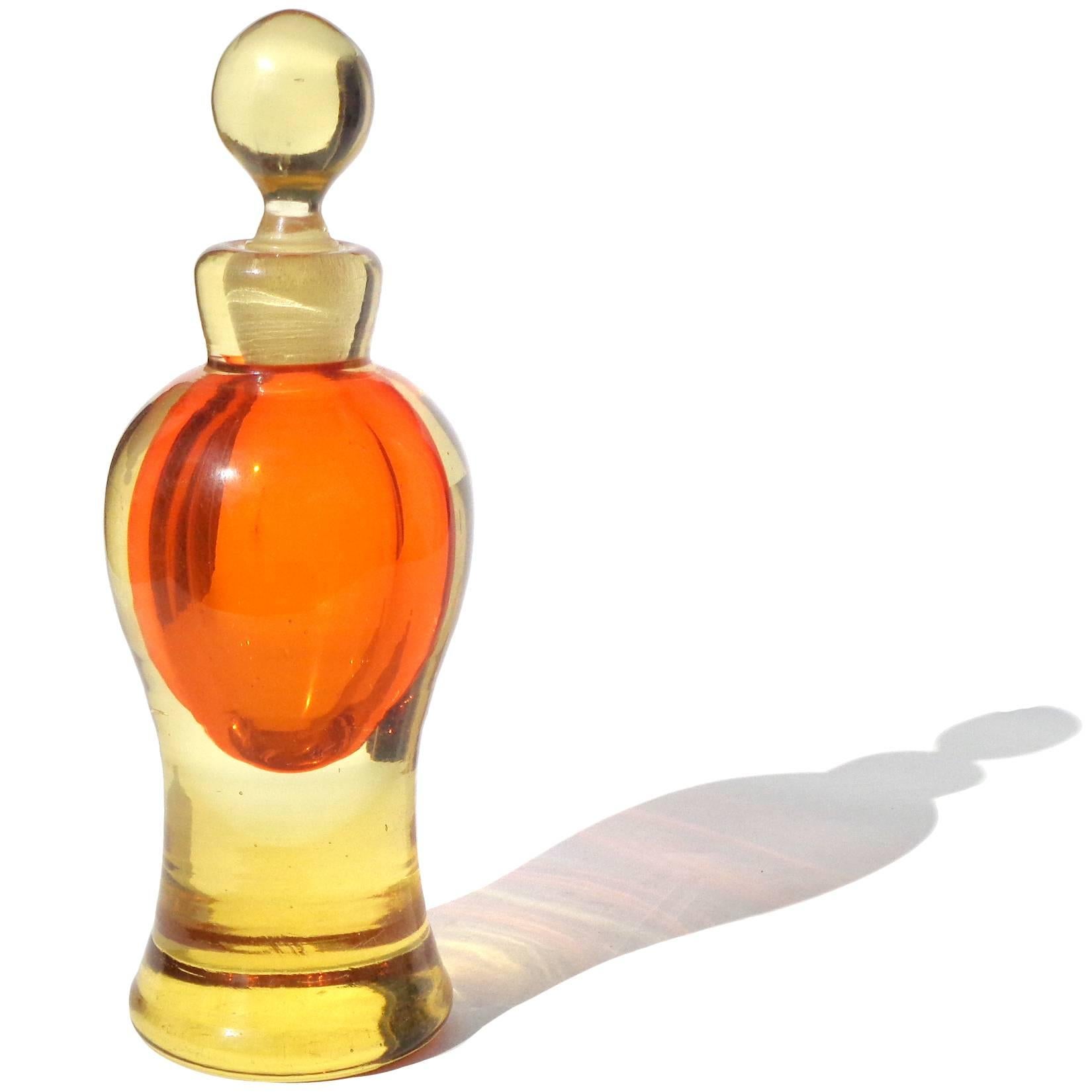 Free shipping worldwide! See details below description.

Beautiful Murano hand blown Sommerso golden yellow over bright orange art glass perfume bottle. Attributed to the Seguso Vetri d'Arte company. Measures 6 1/4