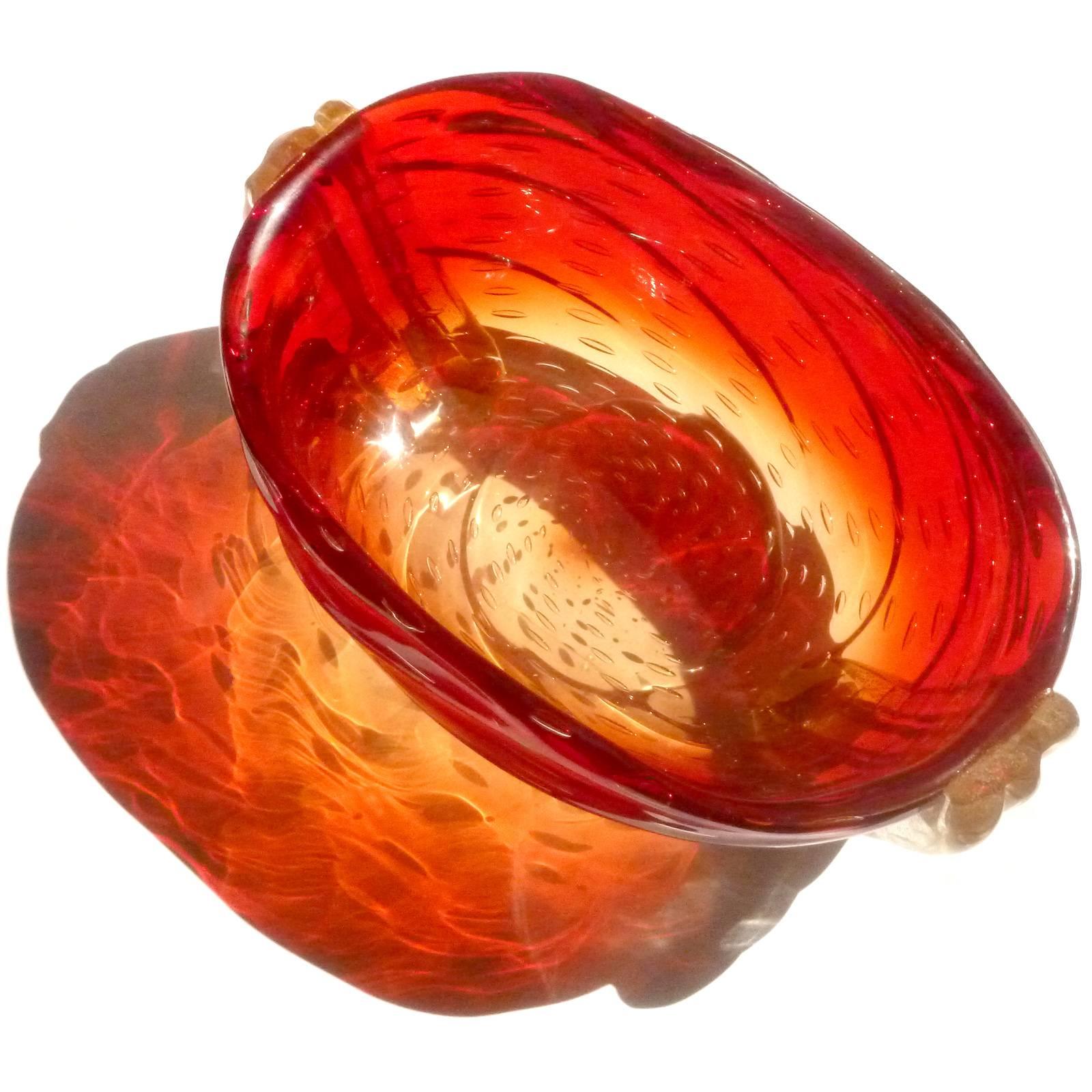 Free shipping worldwide! See details below description.

Murano handblown red orange amberina, controlled bubbles and gold flecks art glass bowl. Documented to the Barovier e Toso company. The piece has a ribbed body, with large bands of gold on
