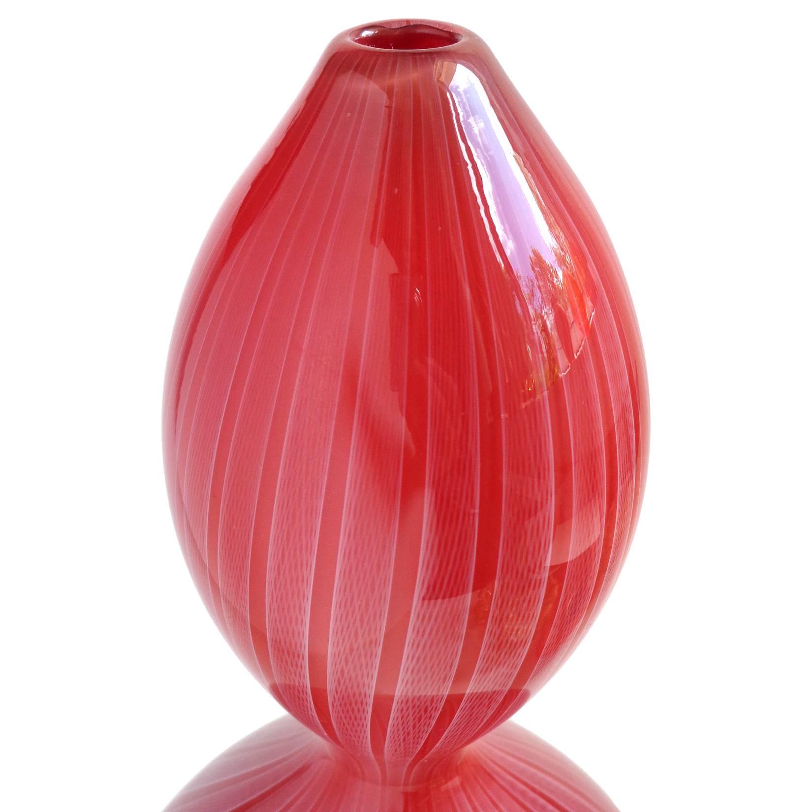 Gorgeous hand blown art glass Solifleur or Specimen gourd shaped flower vase, with Zanfirico net ribbons. The piece is signed Tom Biond (sp?) 2000. Created in the manner of Murano glass. Measures: 10 1/4" tall. 
