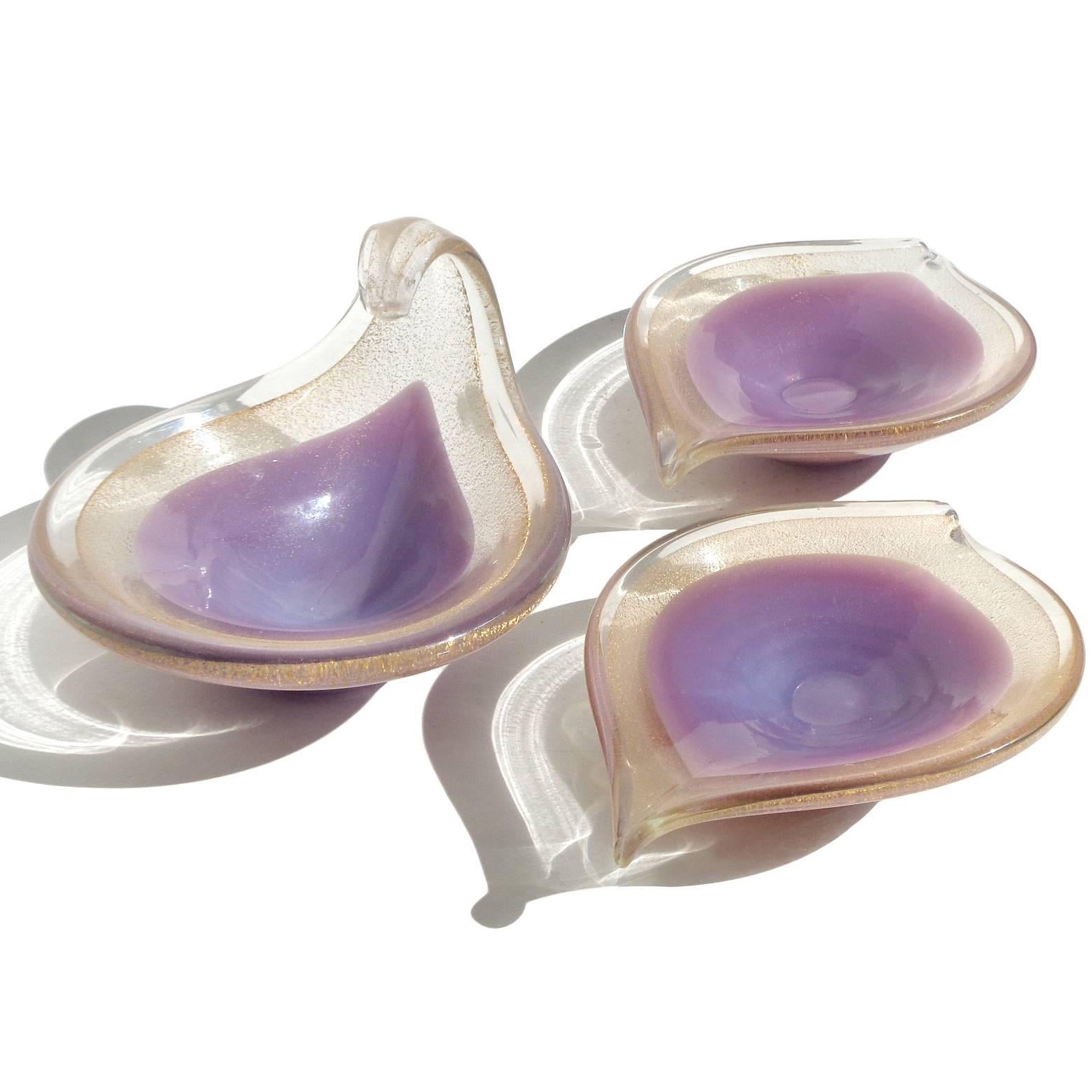 Free shipping worldwide! See details below description.

Beautiful set of Murano handblown gold flecks over purple / lavender art glass ring or trinket bowls / dishes. Documented to the Salviati Company, circa 1950s. Simple and elegant shapes.
