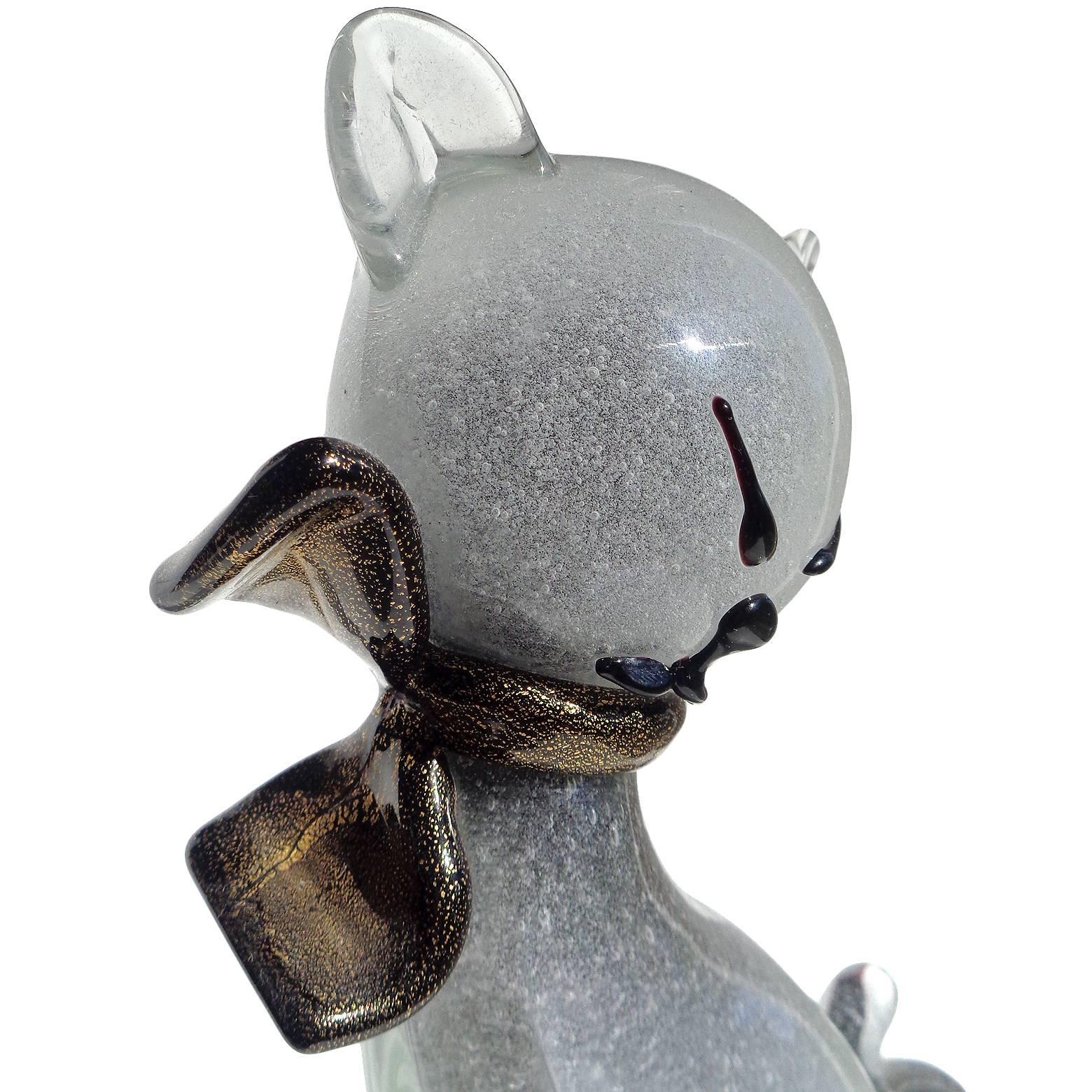 Gorgeous Murano hand blown Pulegoso tiny bubbles over black core and gold flecks Italian art glass cat figurine or sculpture with bow. Documented to designer Alfredo Barbini, circa 1950s. It is published in his catalog. The kitten has a very elegant