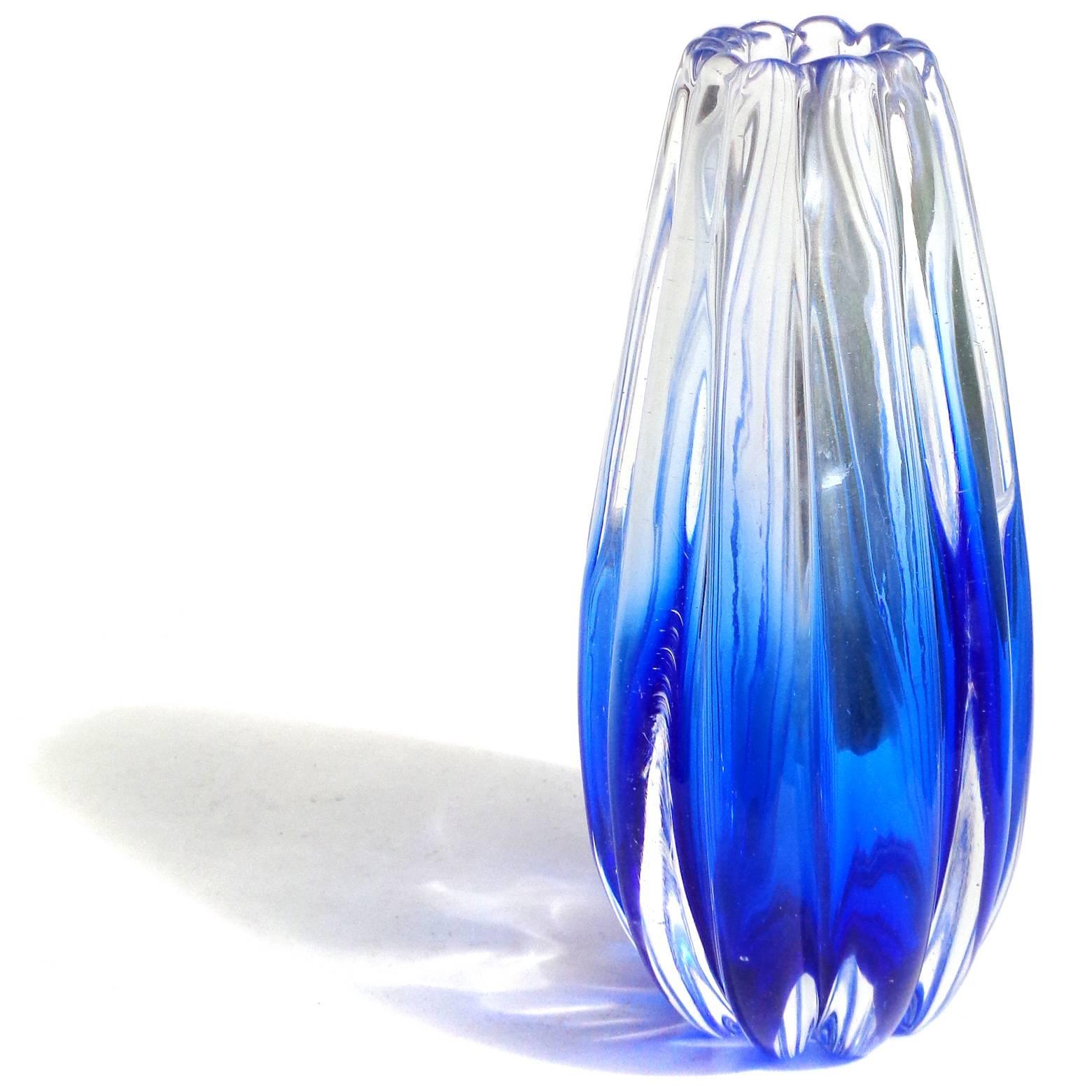 Free shipping worldwide! See details below description.

Beautiful Murano handblown Sommerso cobalt blue, ribbed art glass flower vase. Documented to designer Flavio Poli for Seguso Vetri D' Arte, number 12024, circa 1958. The piece has two